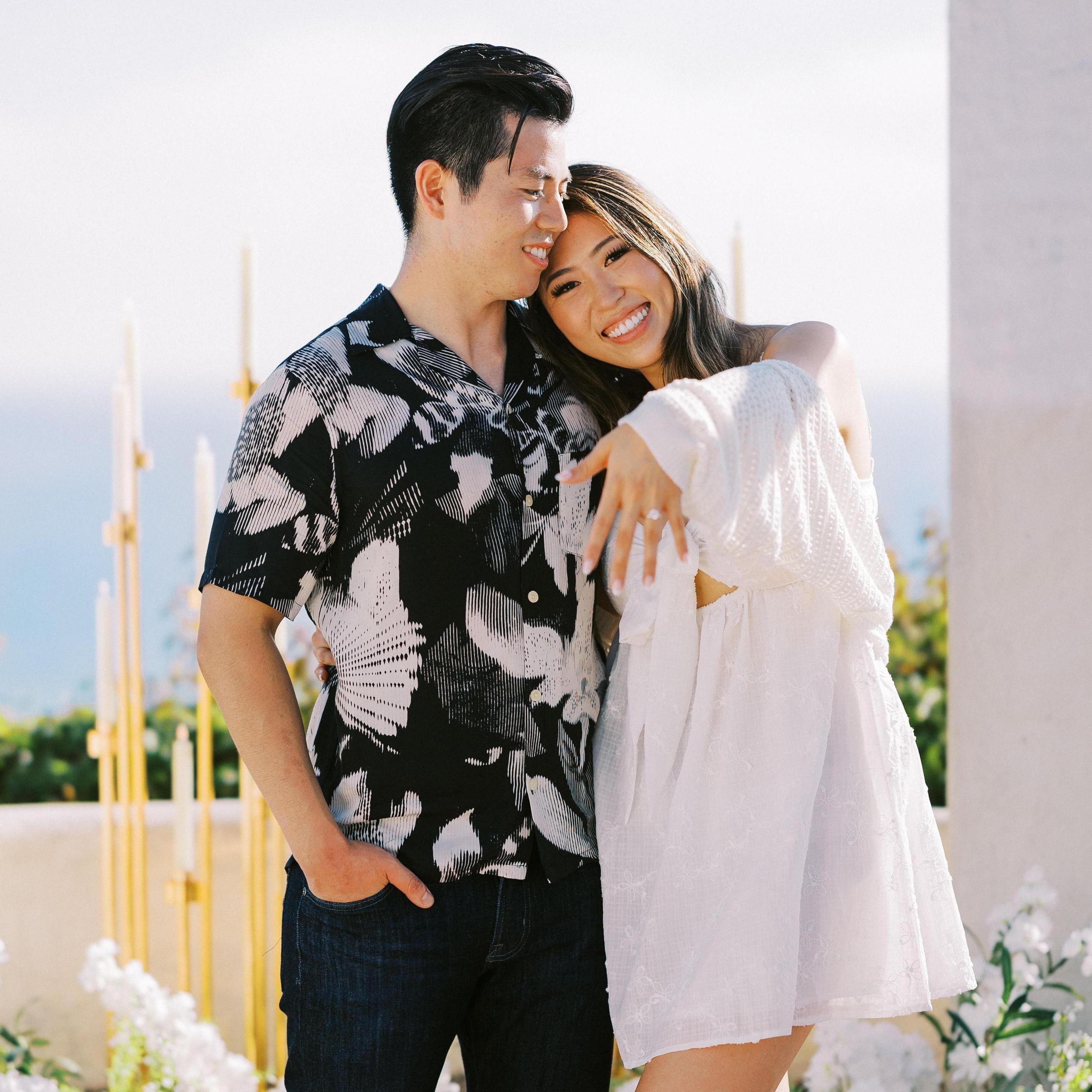 7.27.24 We're Engaged! Lisa was completely surprised by the proposal—thanks to a top-secret master plan that involved a third wheel on their anniversary weekend!  Bryce popped the question at Palisades Gazebo in Dana Point!