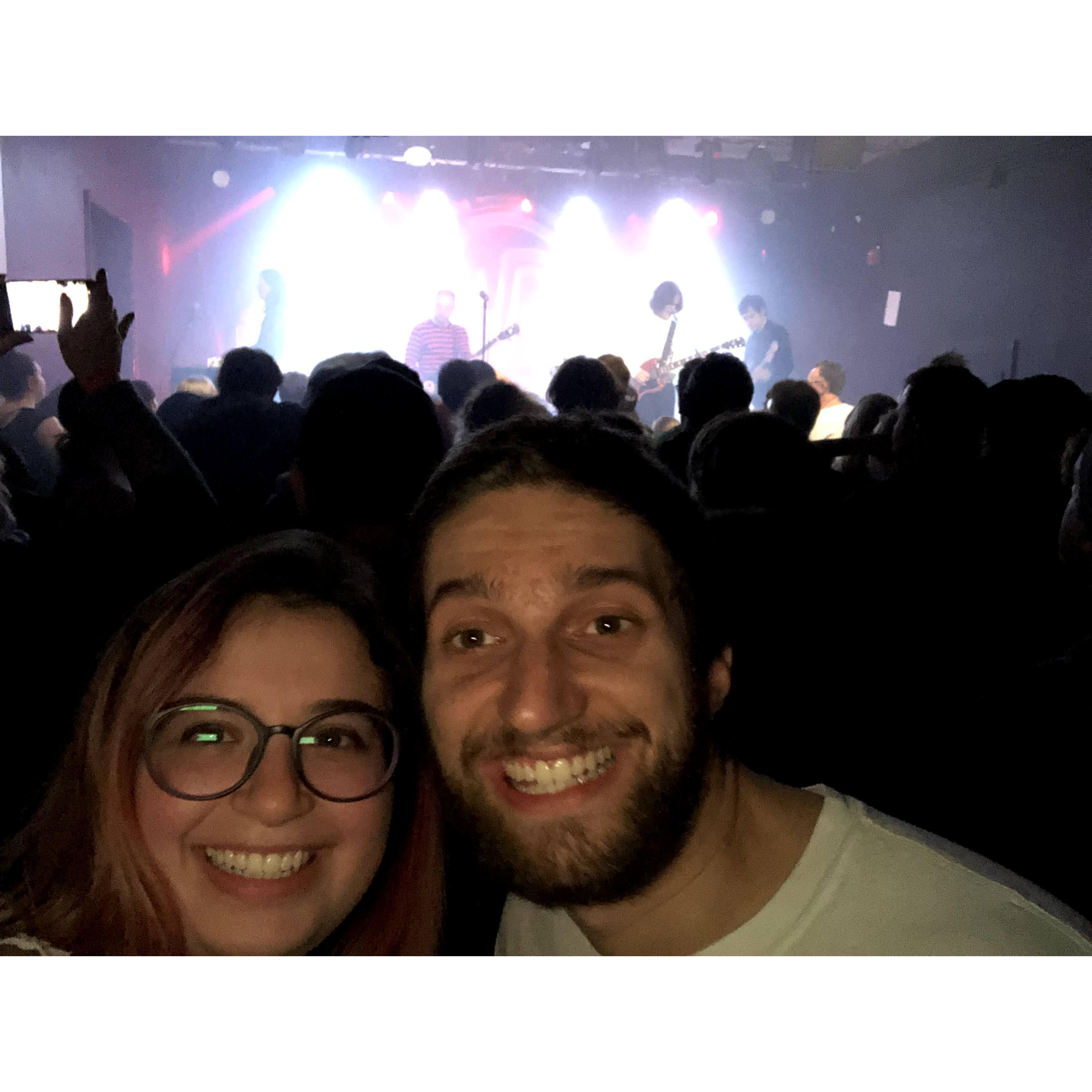 Nathan introduced Ellie to lots of cool music. He hates this photo