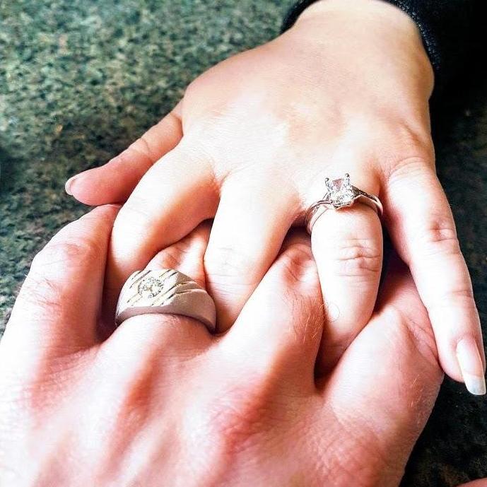 Newly engaged around Valentine's Day!!  In Great Britain, a lot of men prefer to wear traditional engagement rings as well.