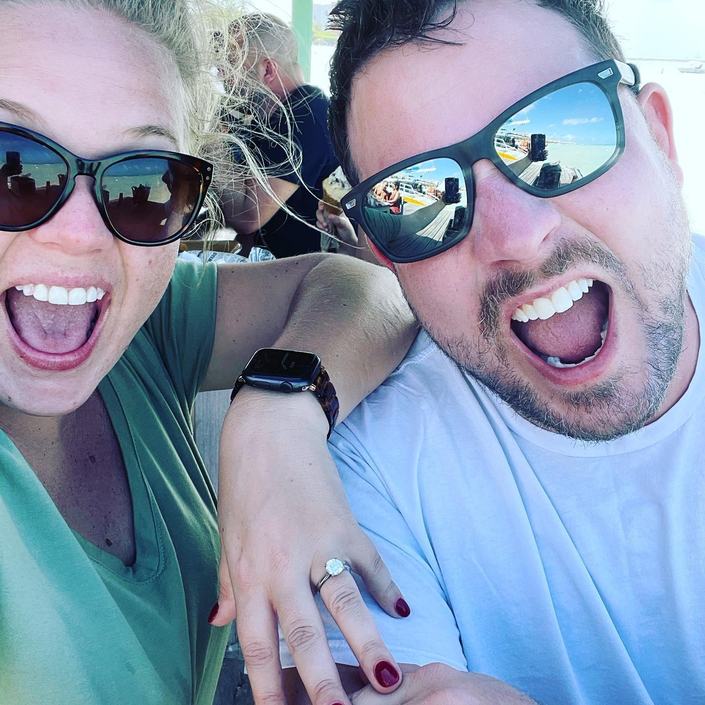 The day after Alex and Ryan got engaged--enjoying the weather in Aruba at a waterfront cafe!