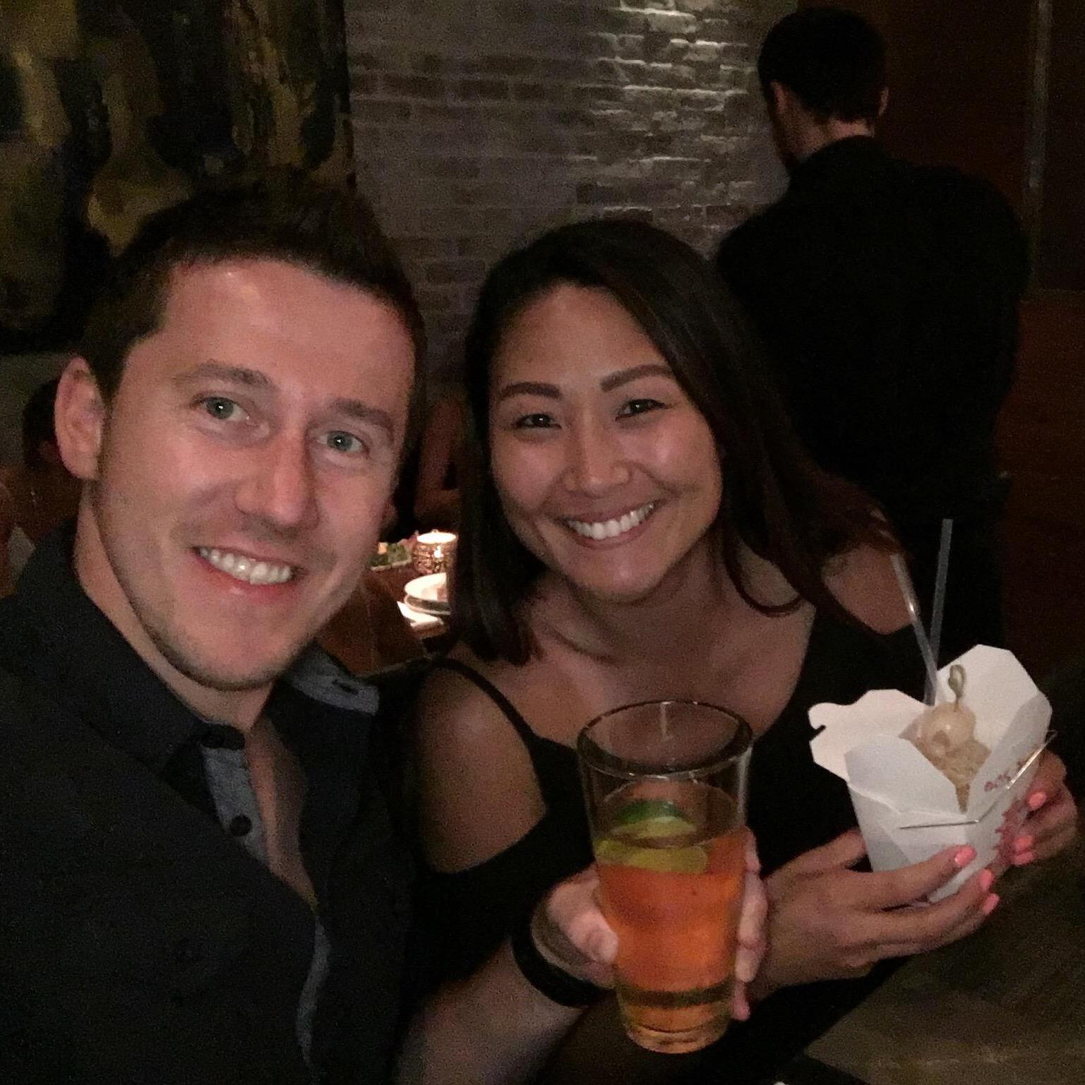 Enjoying some drinks during a night out in Yaletown (Vancouver, BC)... A beer for Alex and a cocktail in a Chinese Take Out Box for Sarah