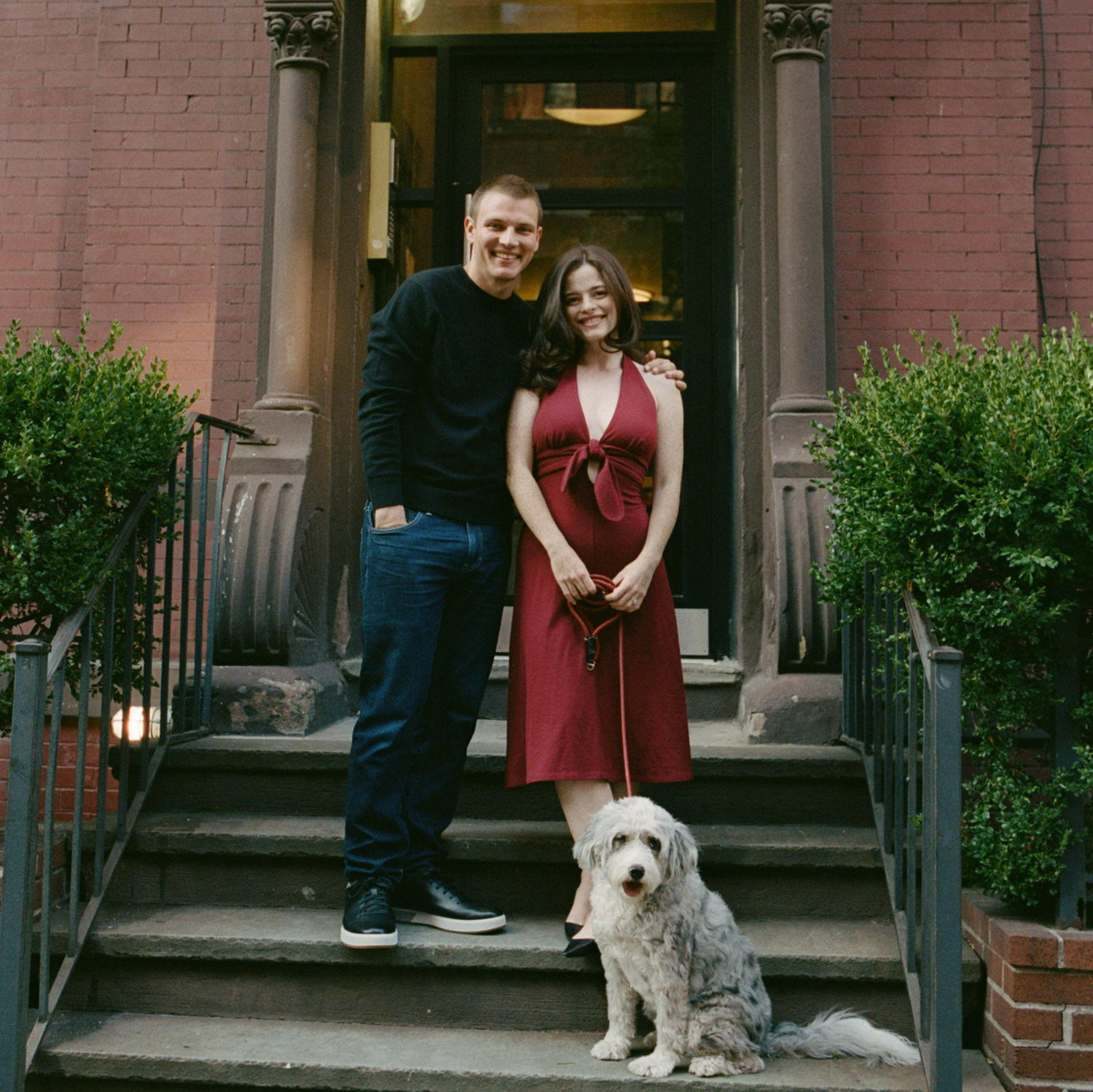 We can't wait to welcome you to our city! Pictured here is our little family on our stoop in Hell's Kitchen.