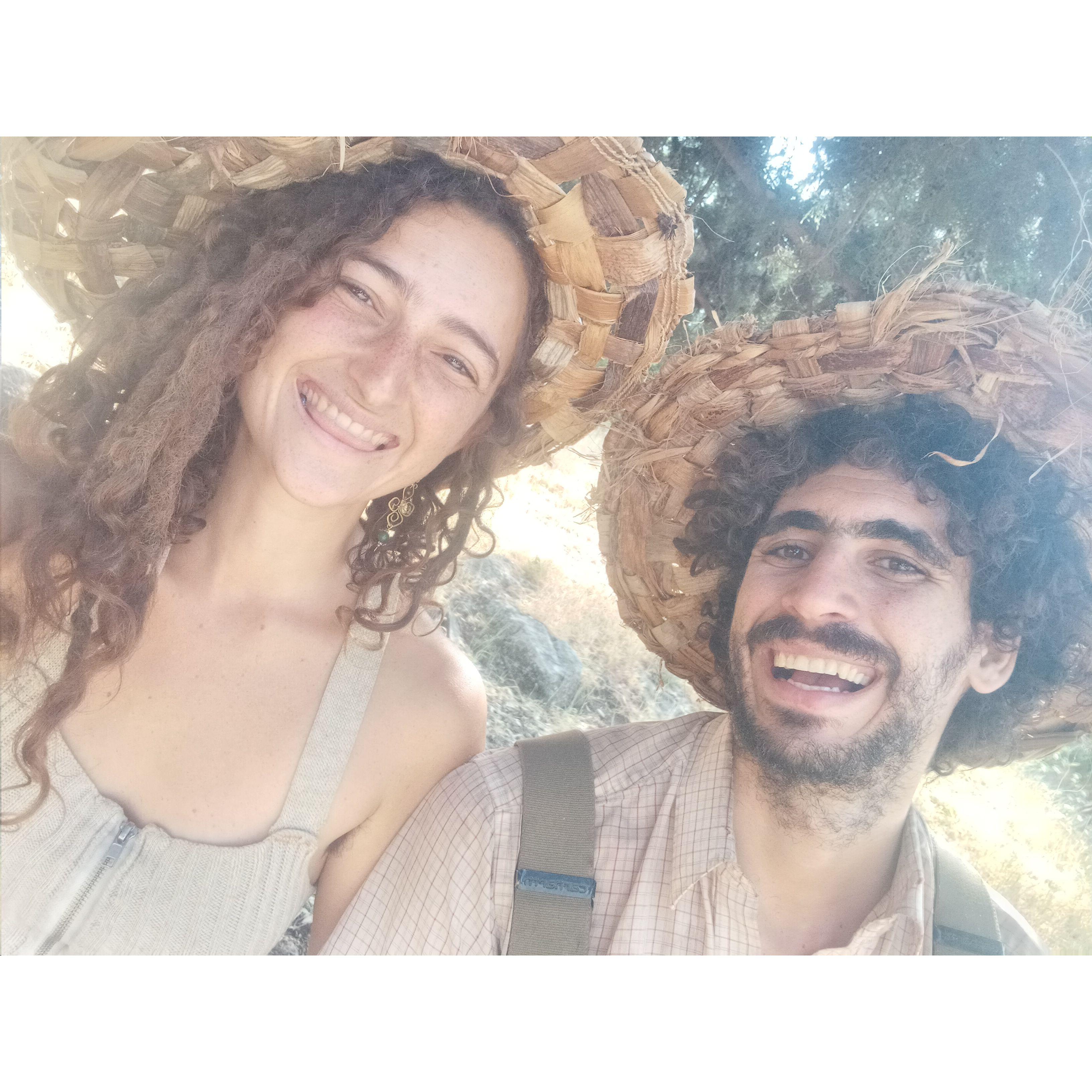 Wearing our newly-woven banana leaf hats while picking mulberries at Ein Phit, Israel!