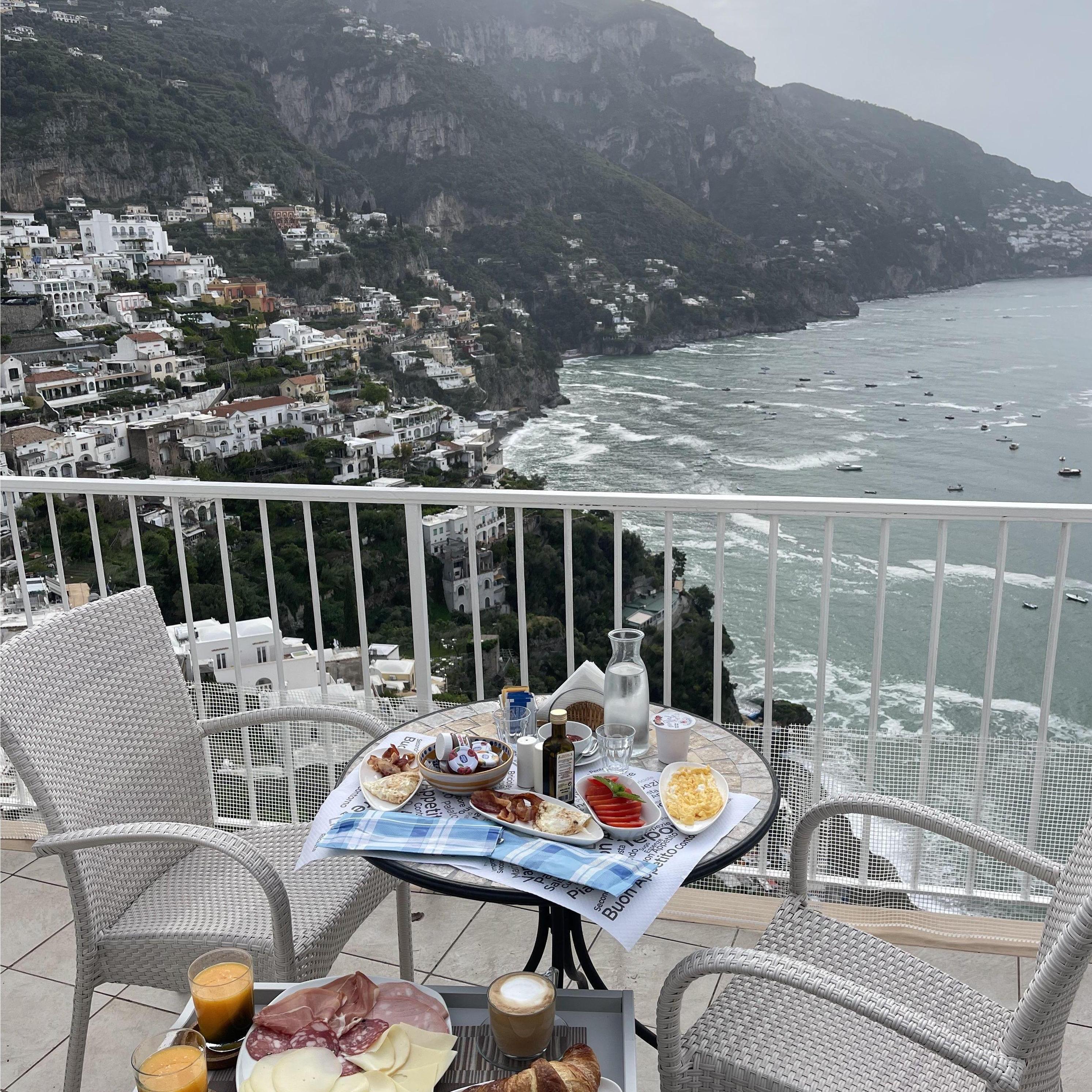 Despite bad luck with weather, we were able to enjoy breakfast on our balcony in Positano, Italy (2023)....