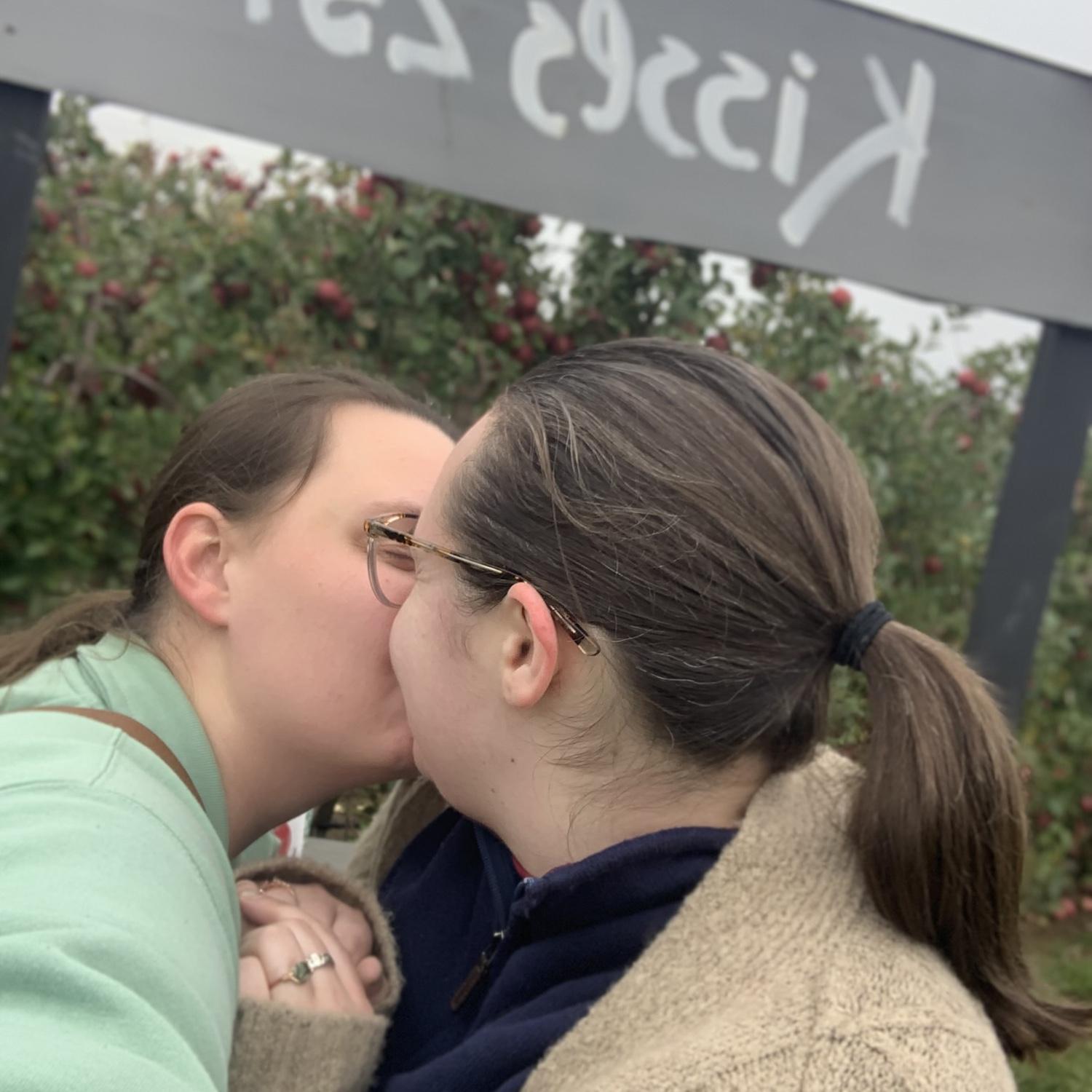 Because we had to get a kiss in front of the kissing booth sign at the apple orchard :)
