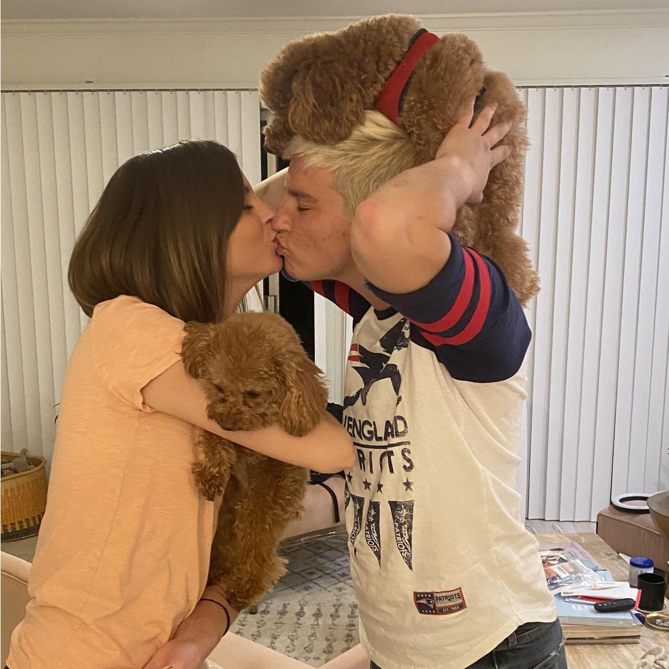 Being silly with our neighbor's golden doodles.