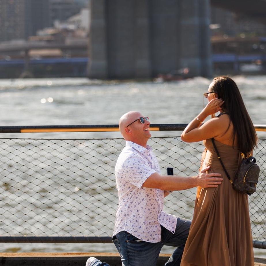 The moment we got engaged. We had lunch at Cecconis with Mikey and Marielena Ferrara. We left the restaurant  and started walking the bridge then Rob got down on one knee. I had no clue!