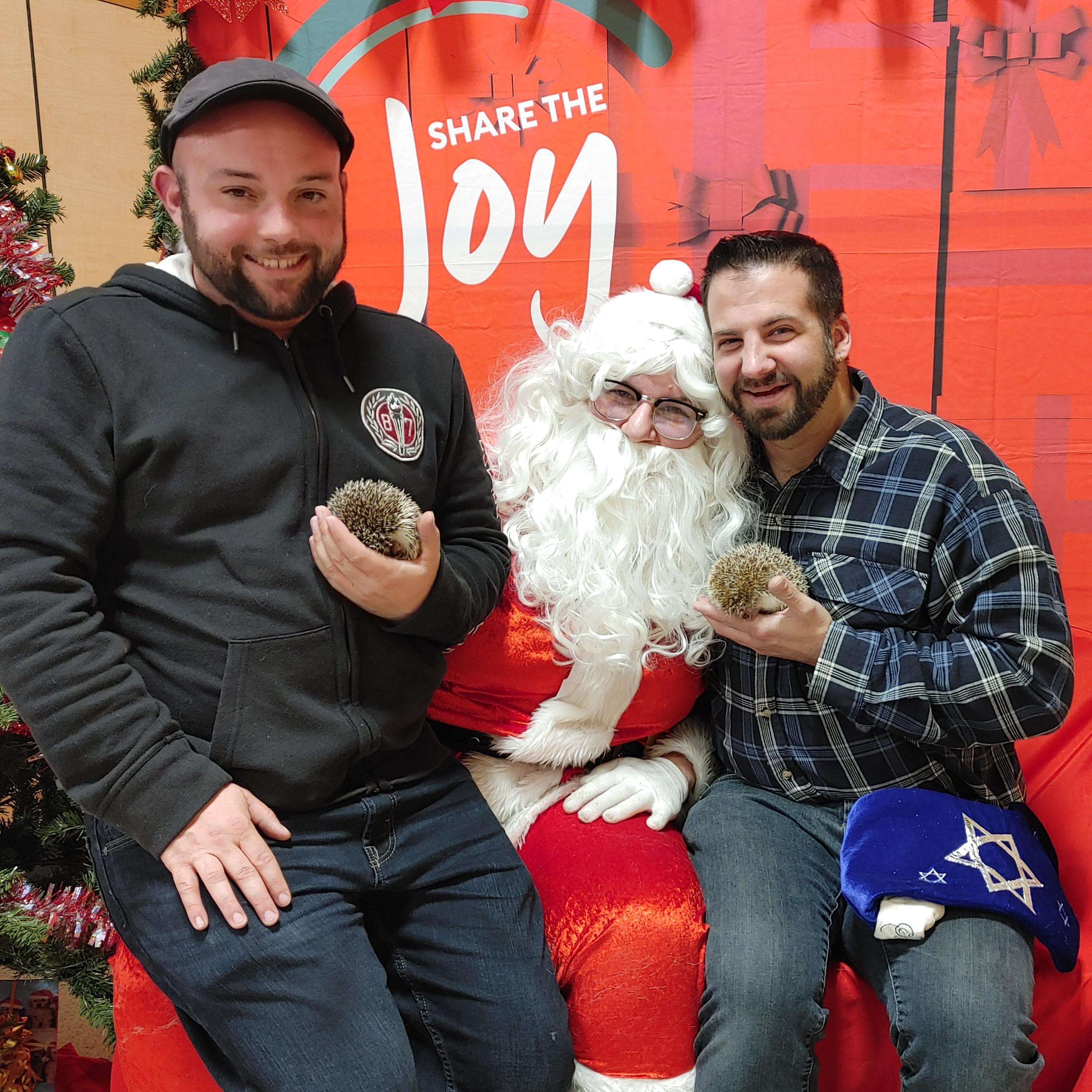 Dec. 11, 2022 - With our friend Robyn playing Santa at PetSmart, we brought our hedgehogs in for photos! Joe is holding MJ and Shawn is holding Louis Phillippe.
