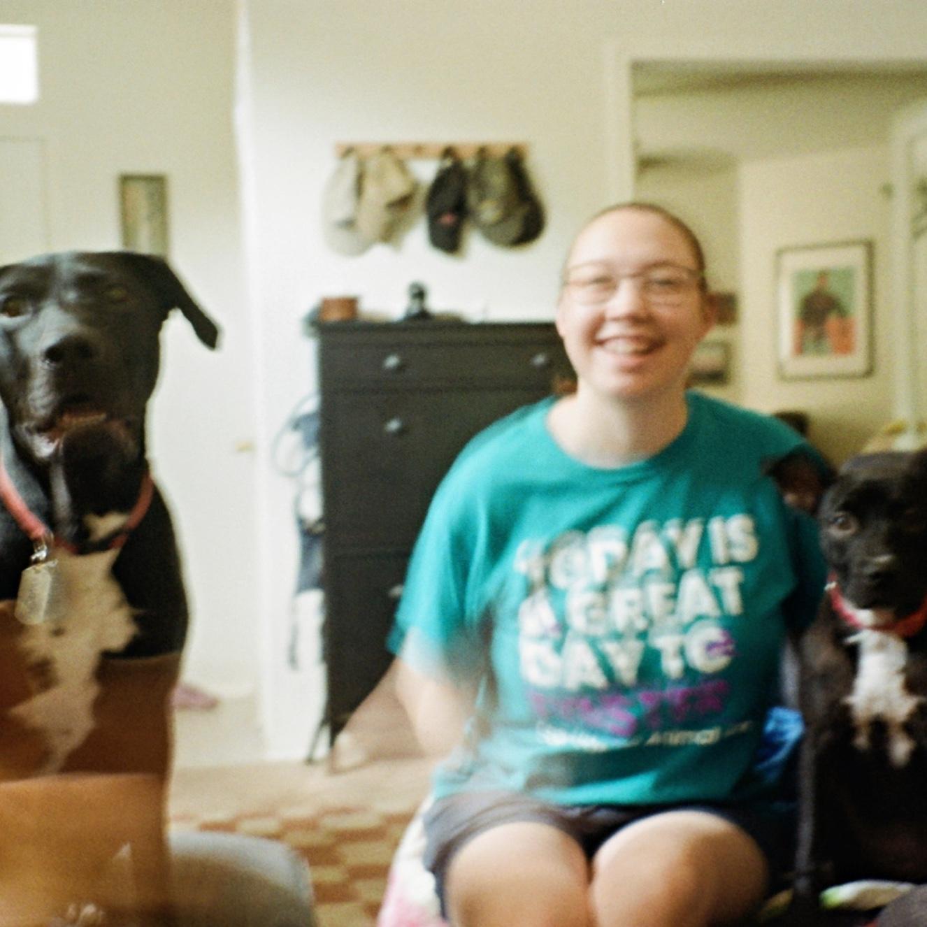 A blurry film picture of Naomi with two of our foster pups, Travis and Cherry!