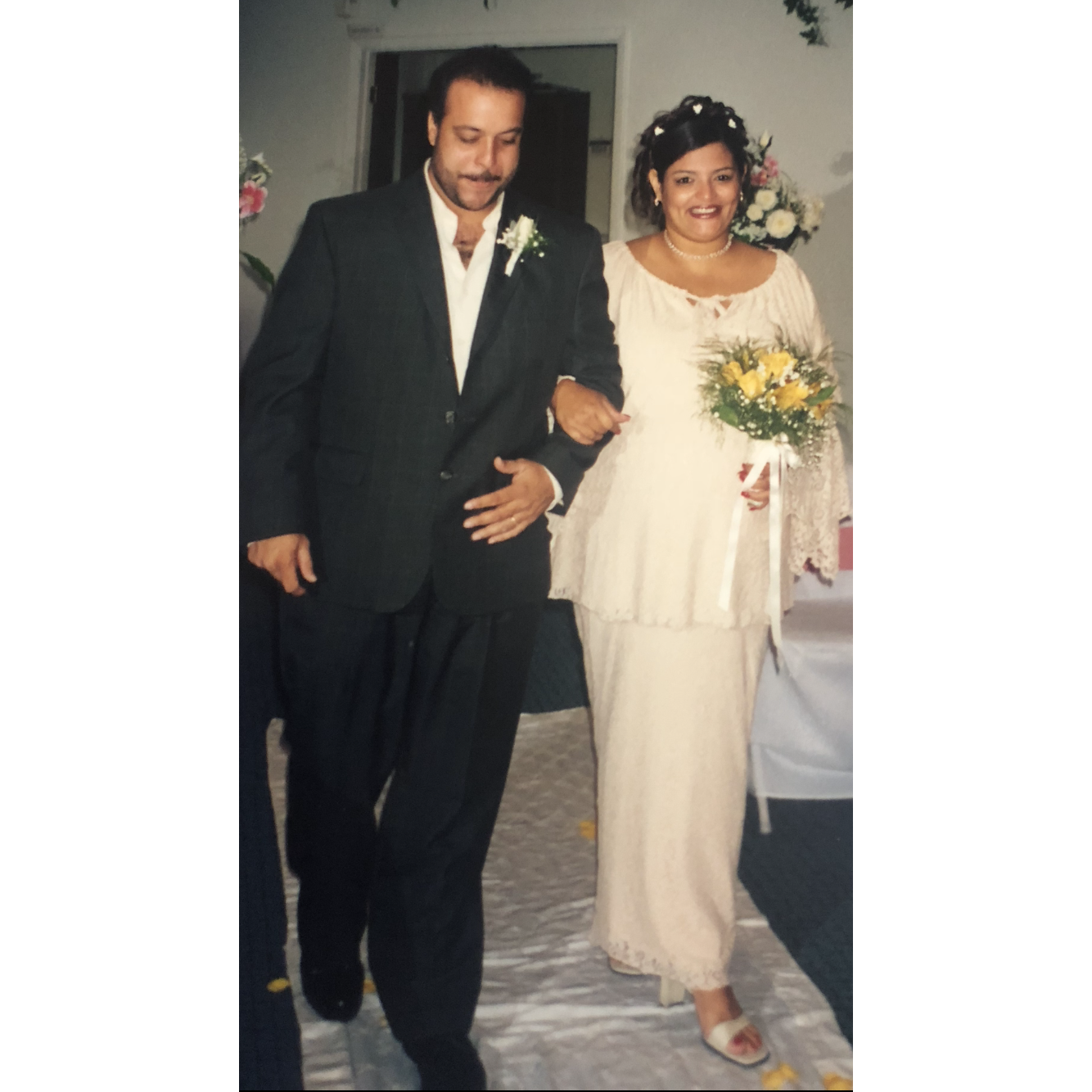 Jorge couldn't wait till I got down the aisle and walked towards me for a hug and kiss.   He said you will never walk alone.  It was everything.