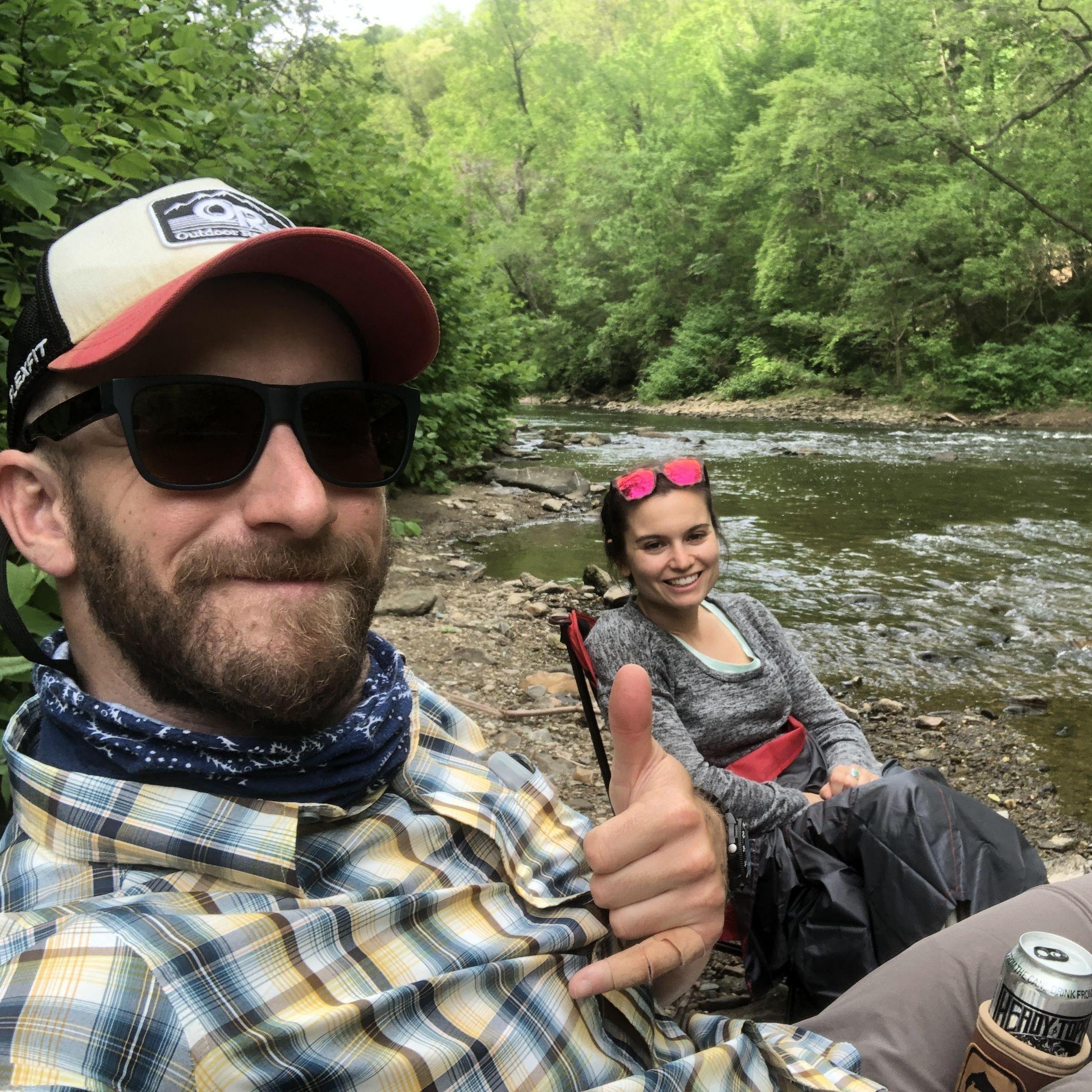 Enjoying the river; Eric about to fish, Emily about to read.