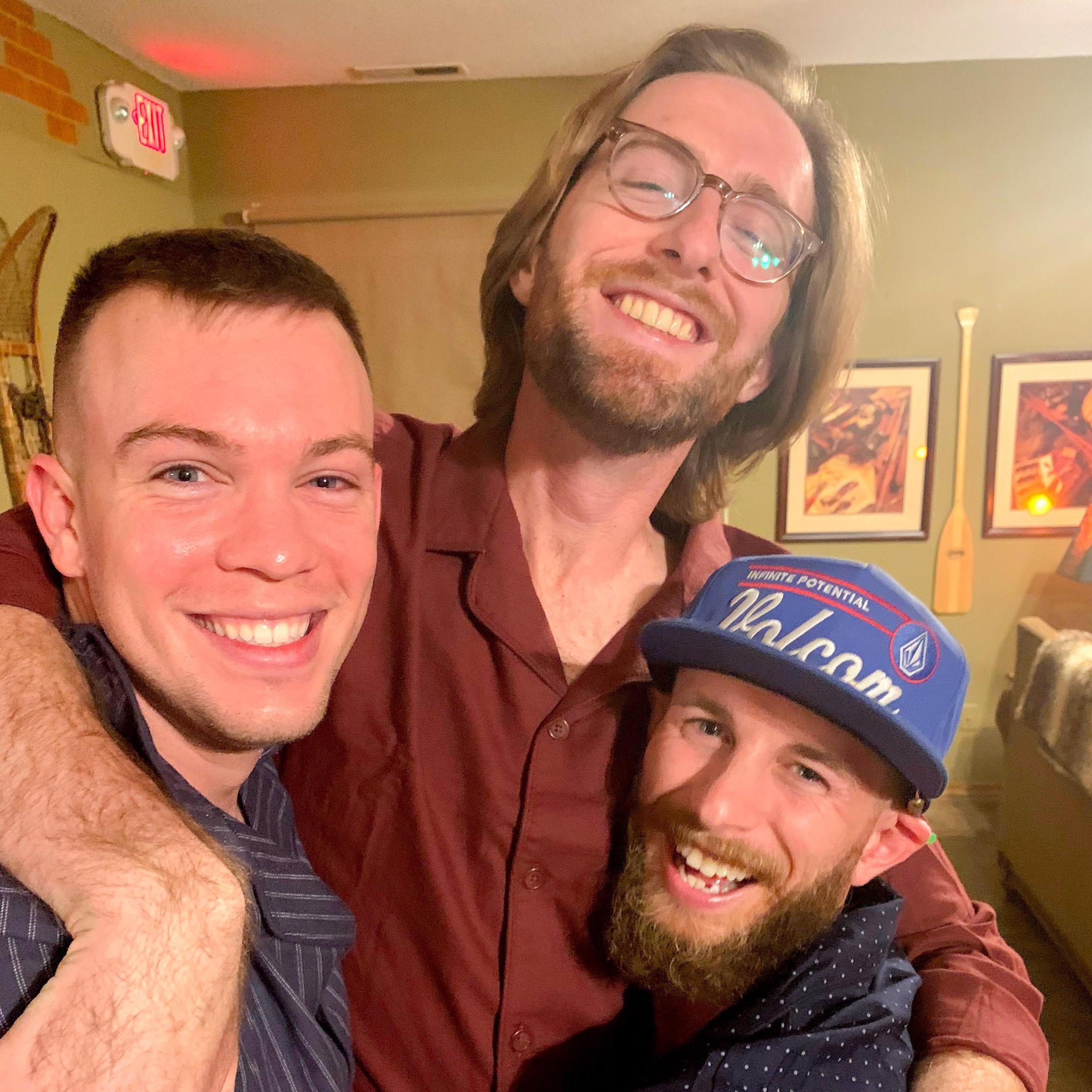 Jacob and 2/3 of his groomsmen wearing matching pjs the night before the Wichita wedding