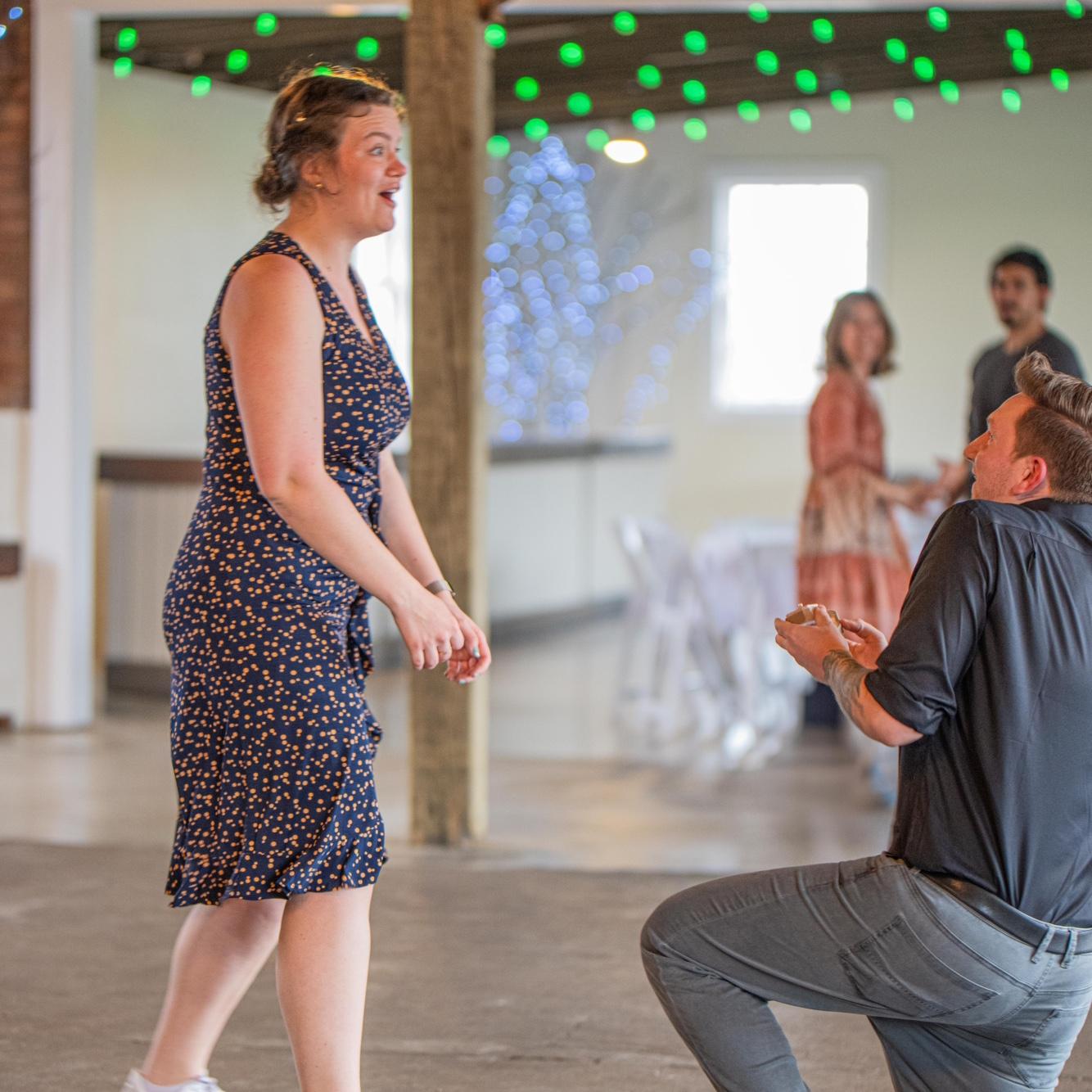 Legend has it Natalie screamed "WHAT" after turning around mid-dancing to find Austin on one knee.
