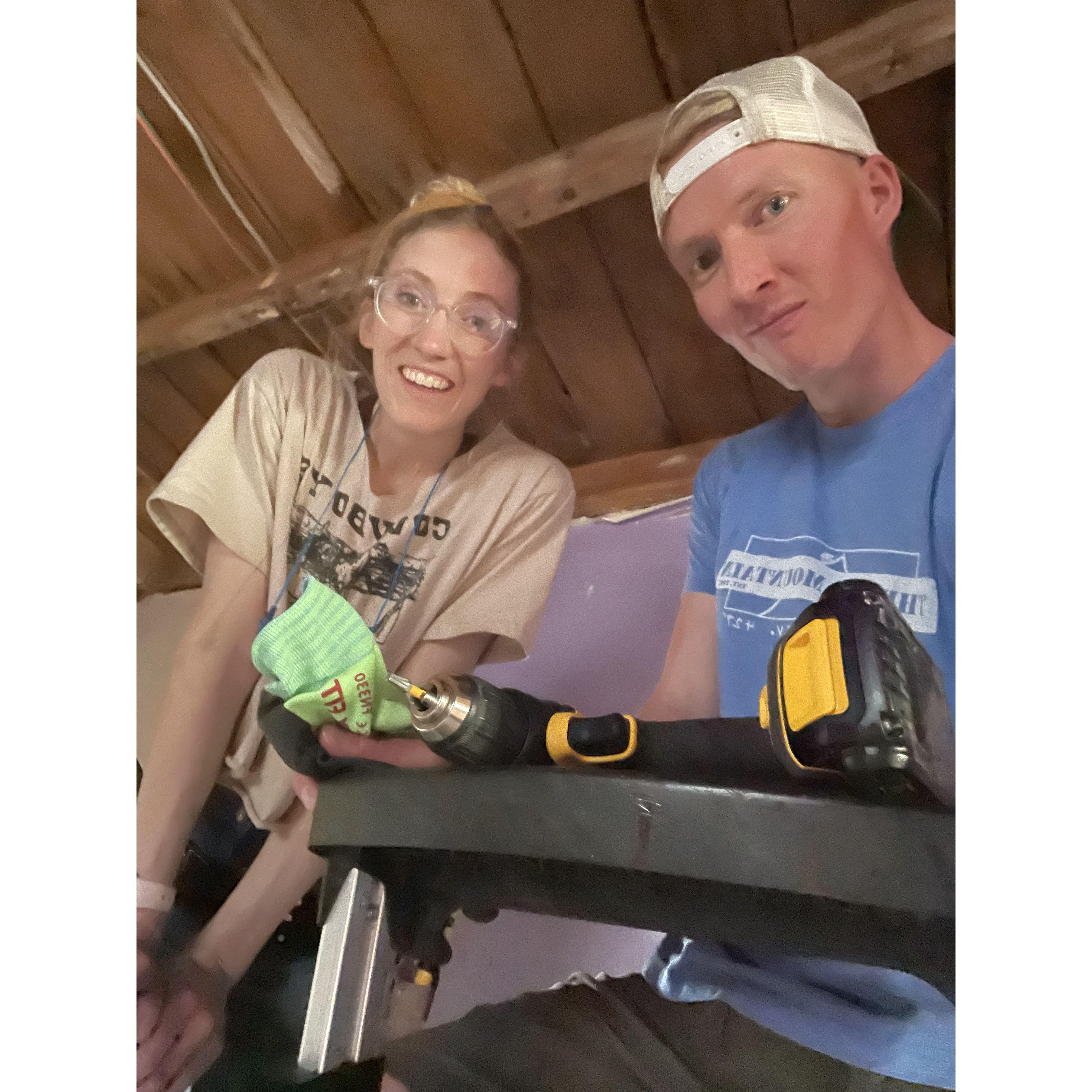 Alex helping Kitt renovate her house.
