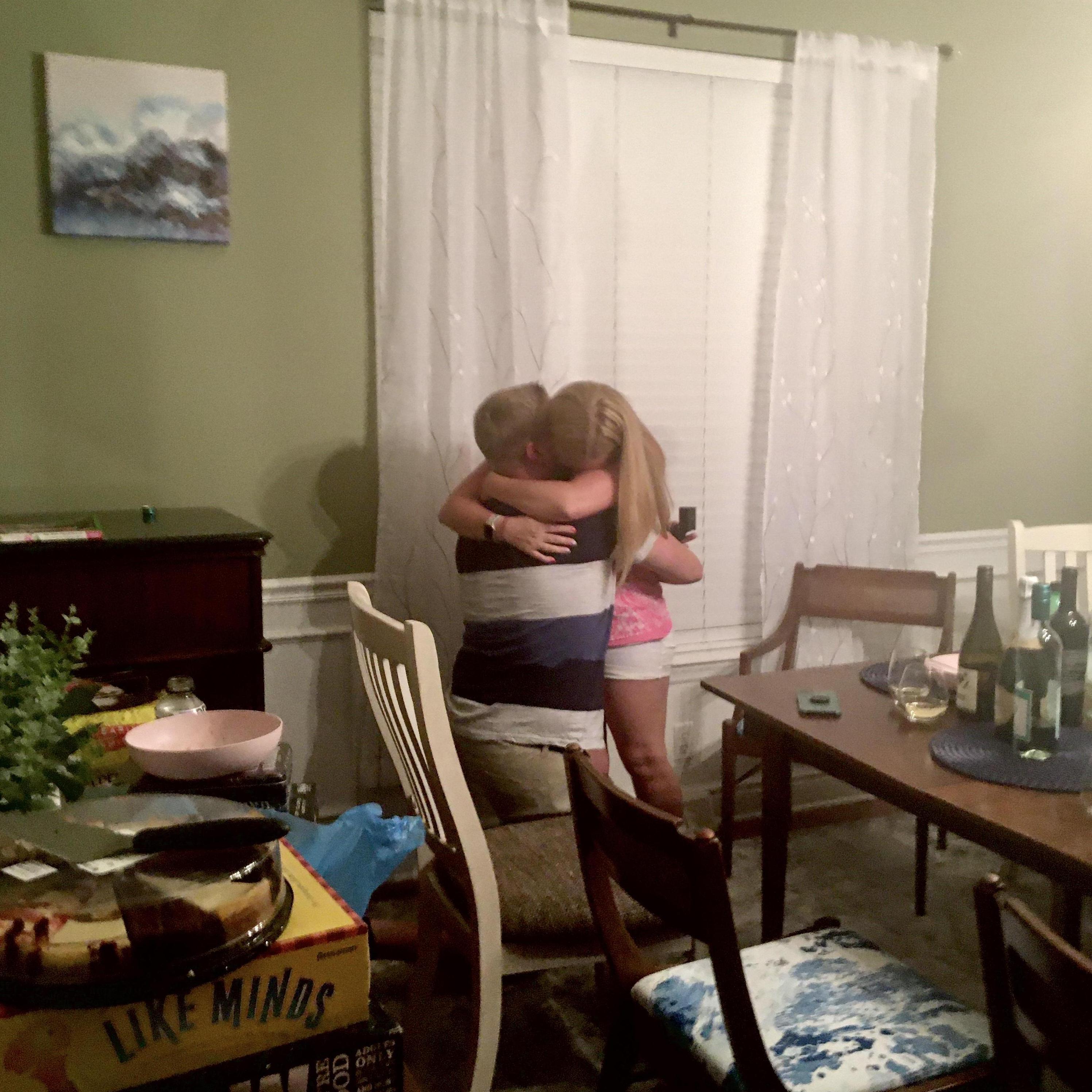 June 19: Luke proposes to Andrea in their dining room during a Sing Hosanna game night.