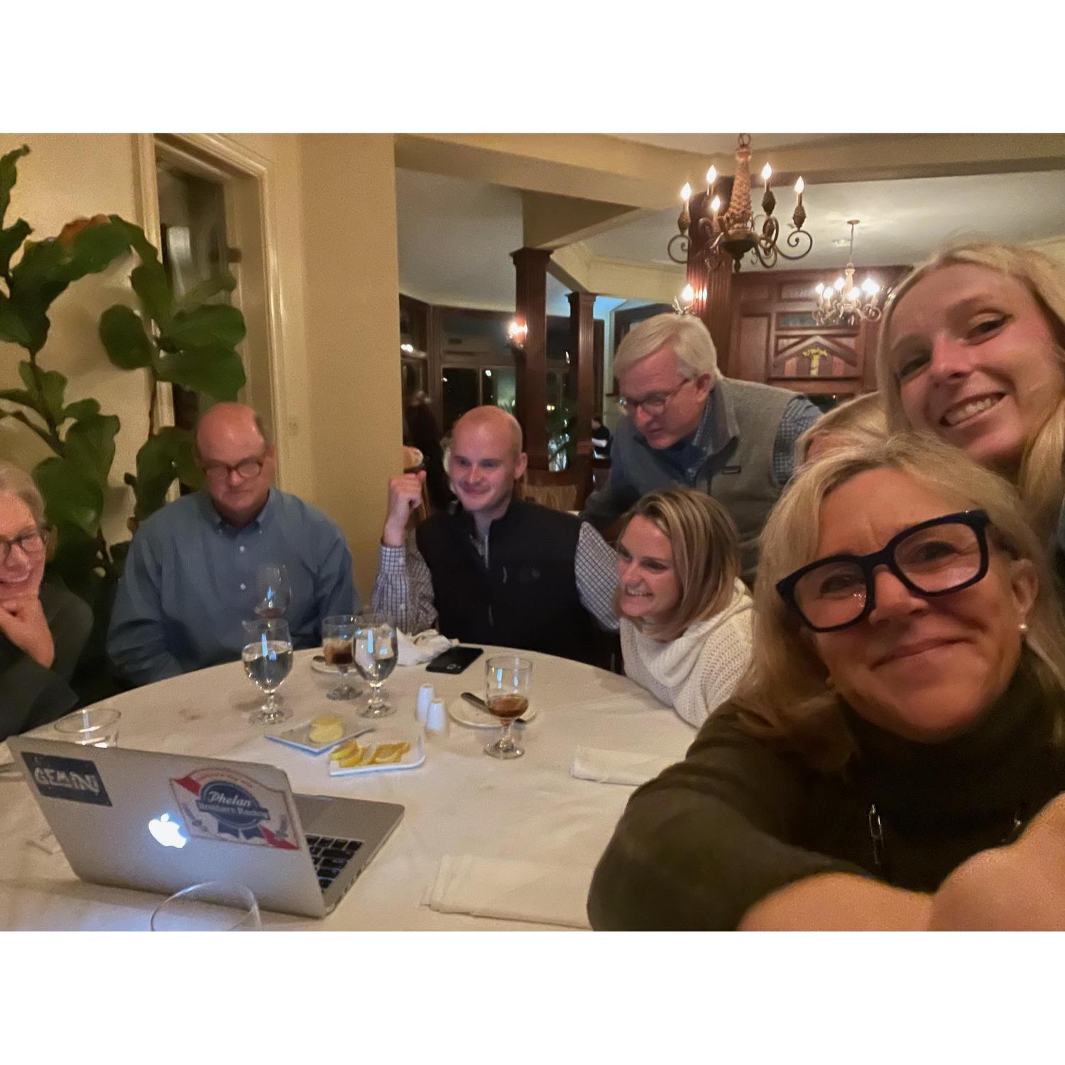 gathered around the computer listening to messages from friends, kay is pleased that the surprise was a hit