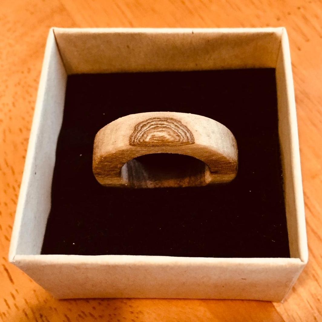 On August 14th, 2020, Gary proposed in our backyard in Culver City, under the Plumeria, with this beautiful ring he made by hand from walnut from the backyard in Kansas City.