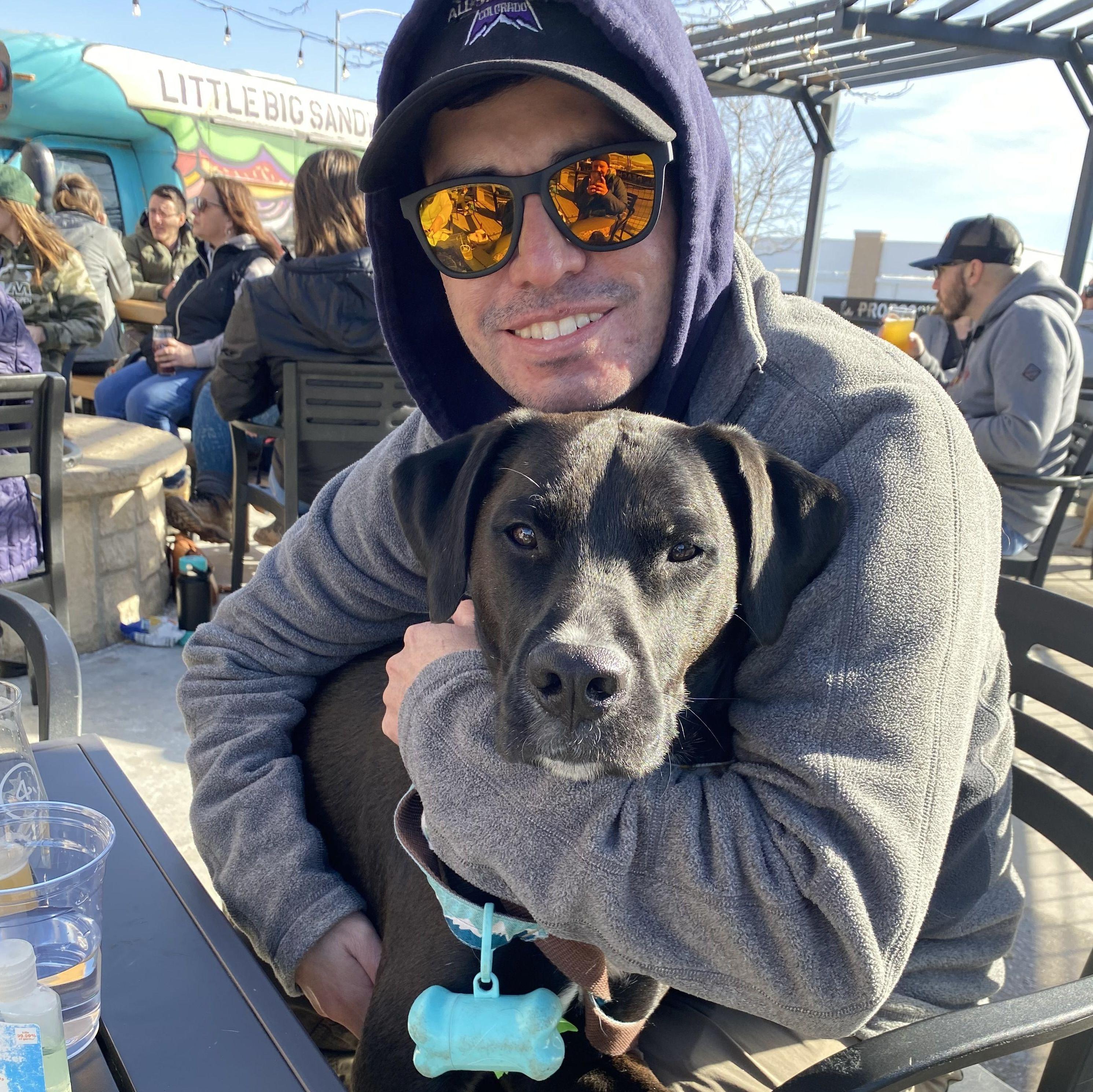 Chris and Ollie enjoying 4 Noses Brewing Company's patio in Broomfield.