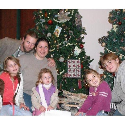 Our first EVER family picture. Heritage Center Theater, Christmas 2009. With - Briony, Paul and kiddos! <3