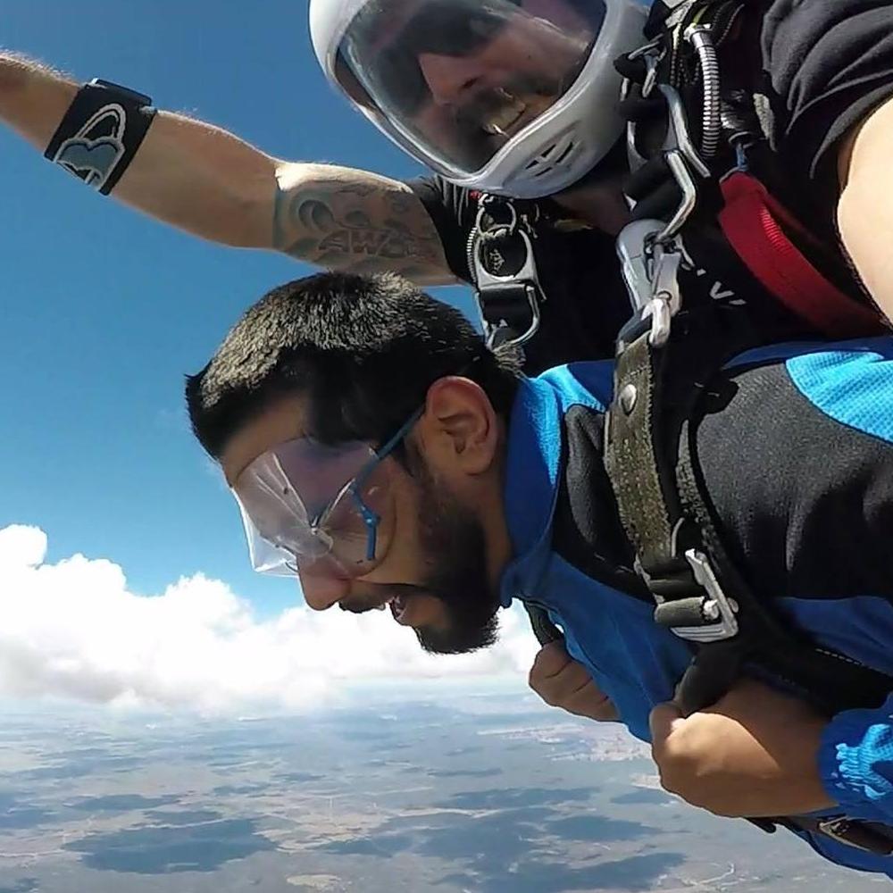 Flying tandem with a skydiving instructor about 13,000 ft in the air.