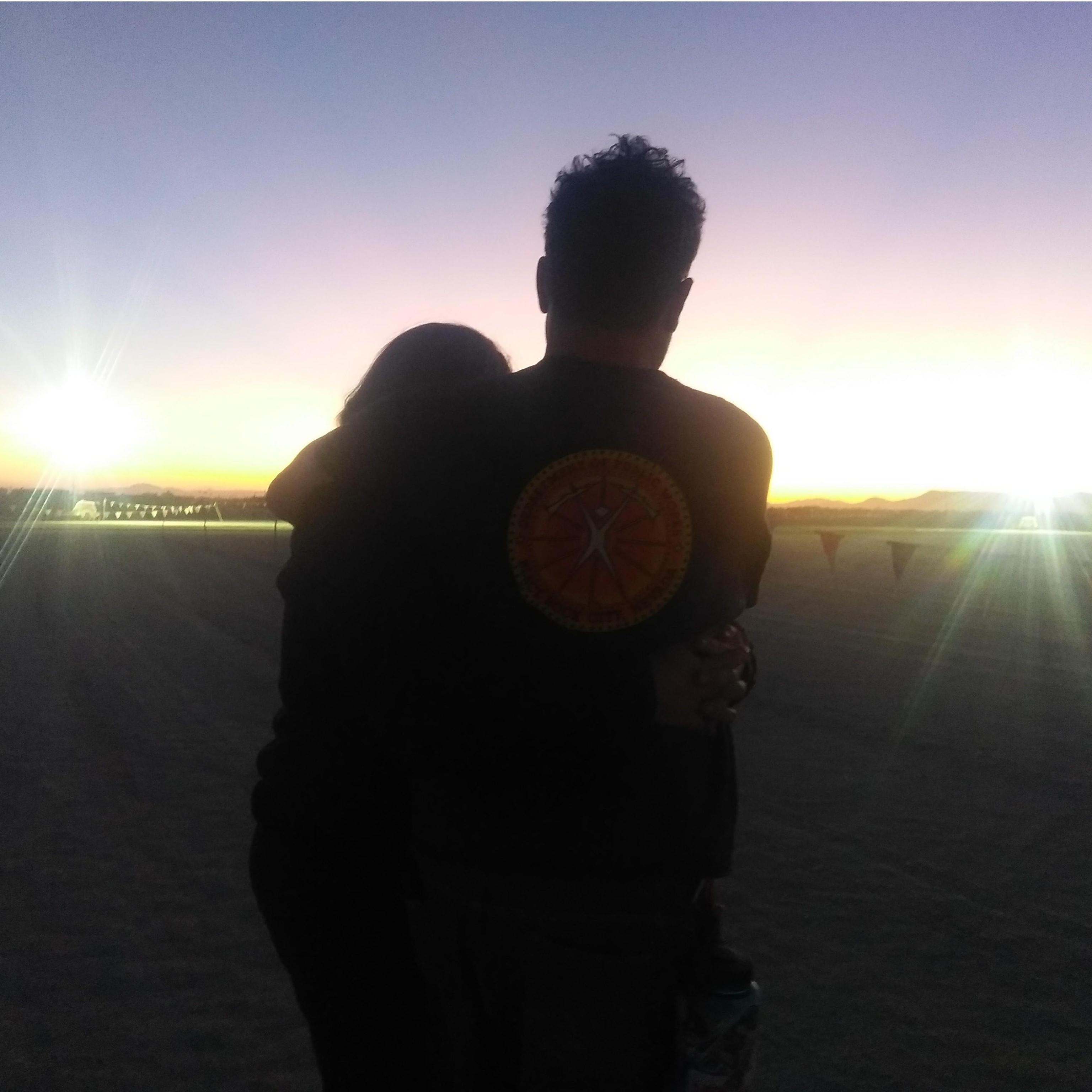 Waiting for my ride back to Texas, shortly after she said yes. My favorite sunrise. My favorite picture of us.