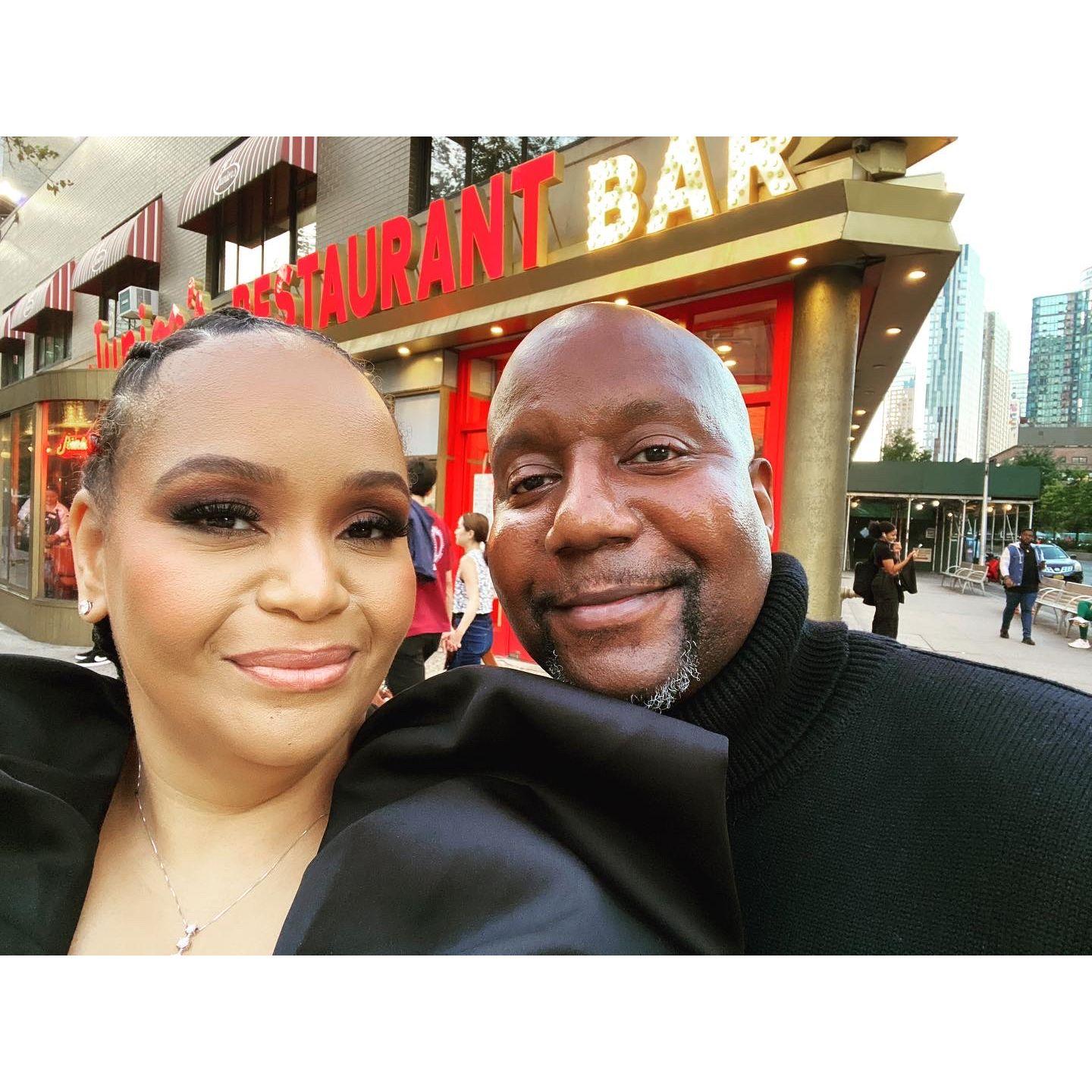 Damien & Mona in front of Junior's - Engagement Photo Shoot 10/1/2023