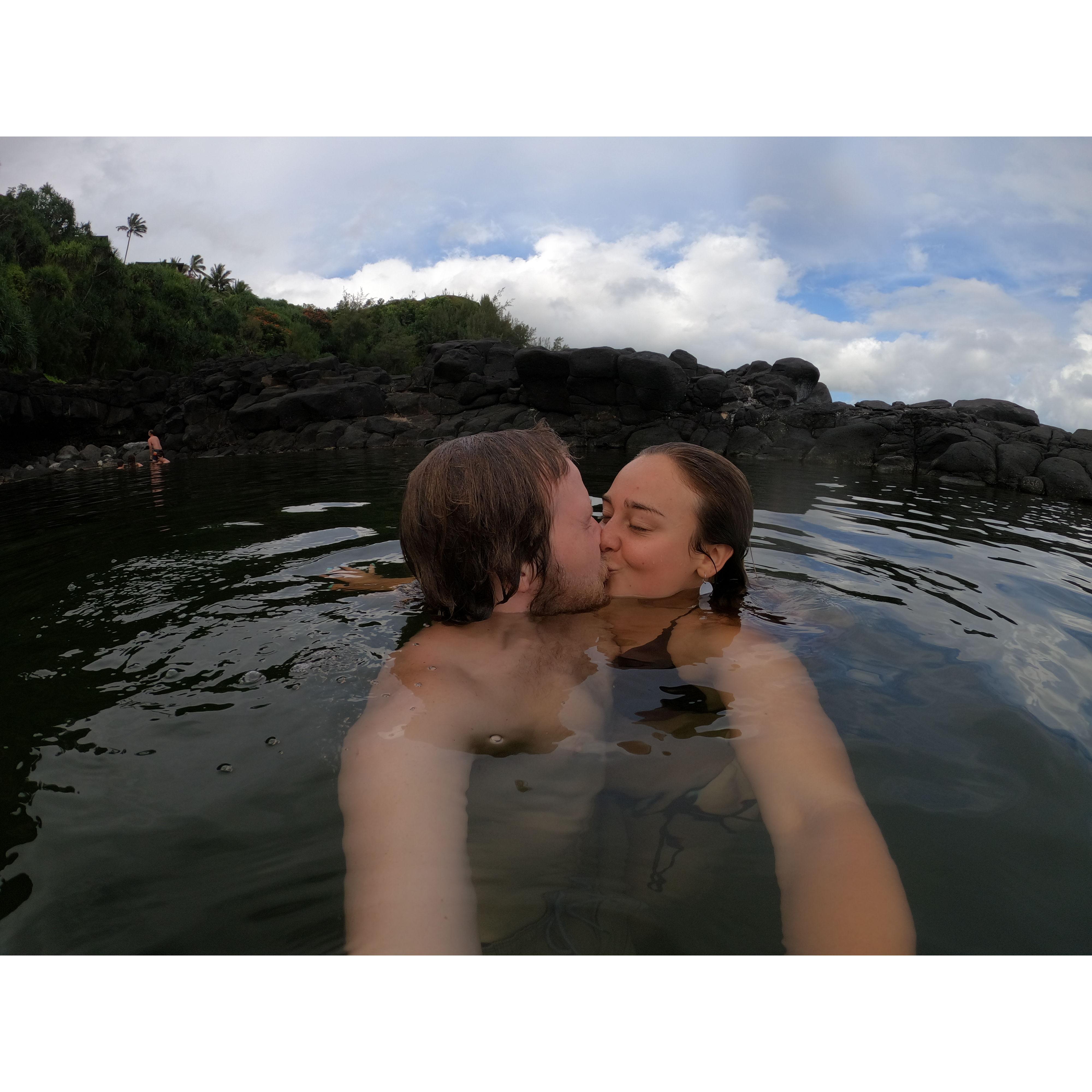 Sharing a Kiss at the Queen's Bath in Kauai, Hawaii