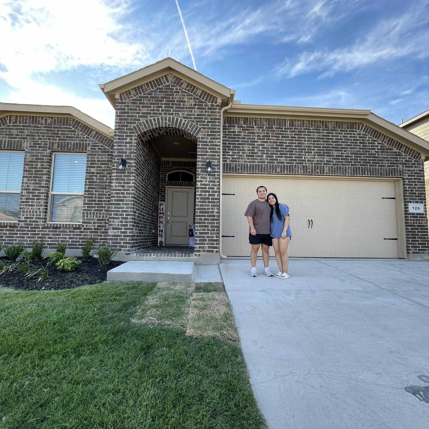 1st picture of us with our new house!- September 2023