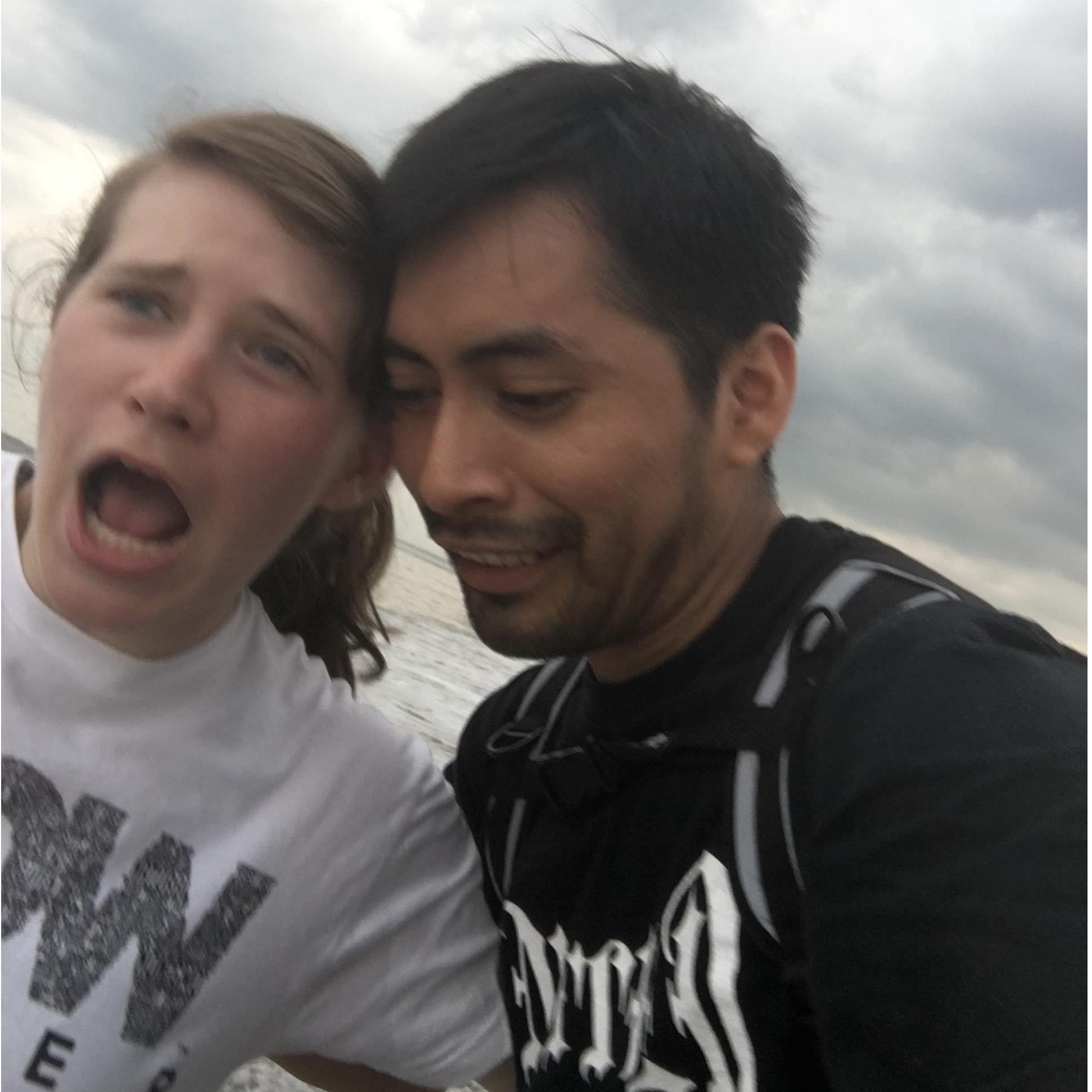 We were squatting down trying to get a nice picture with the beach and sunset in the background. I was oblivious to the water, and Ben snapped this just as a big wave came up and wet my entire bottom