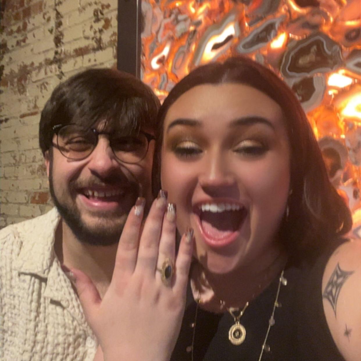 "Guys... he proposed!"