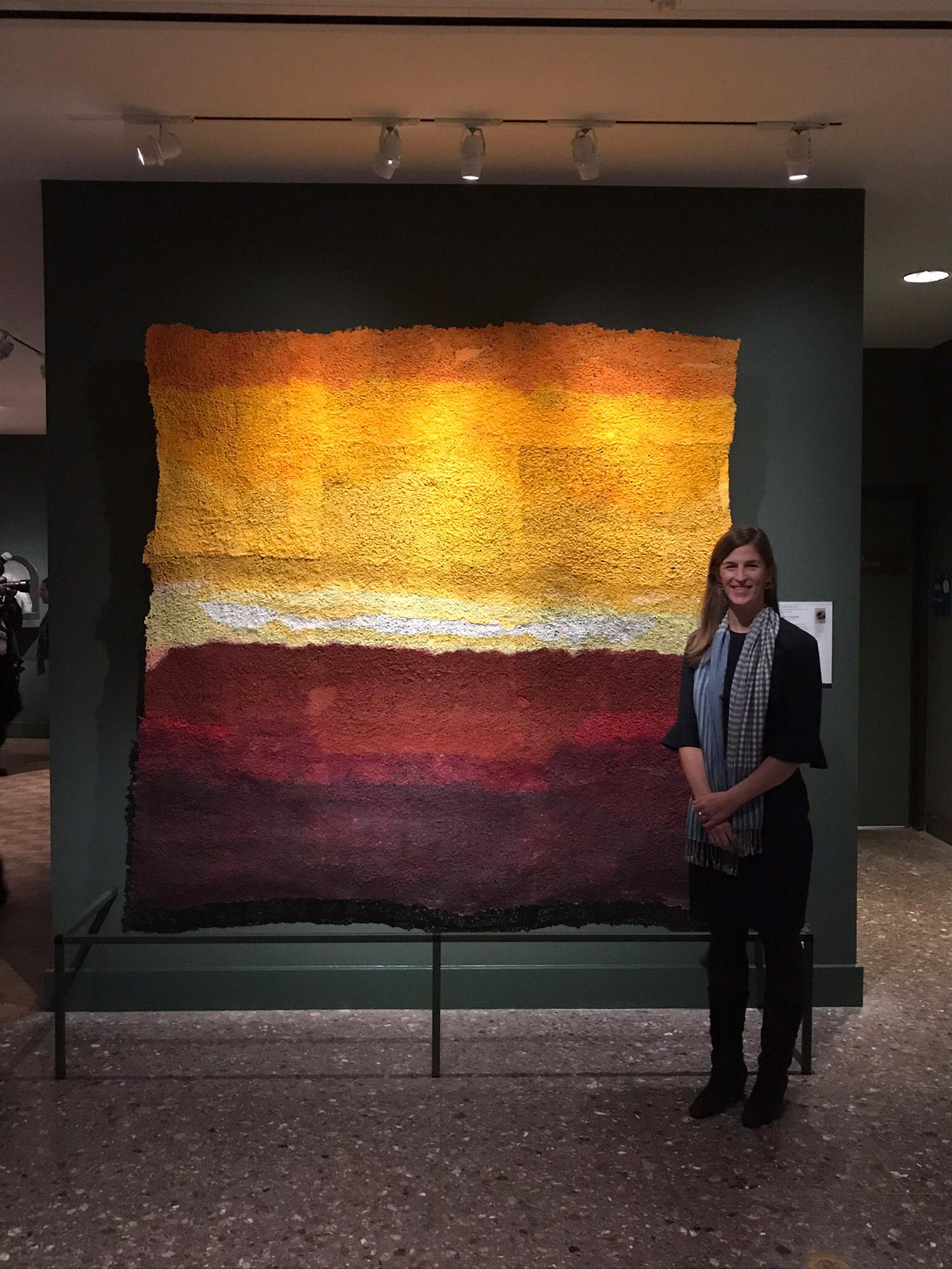 Alison standing in front of a favorite artwork in the new Asian galleries she helped plan