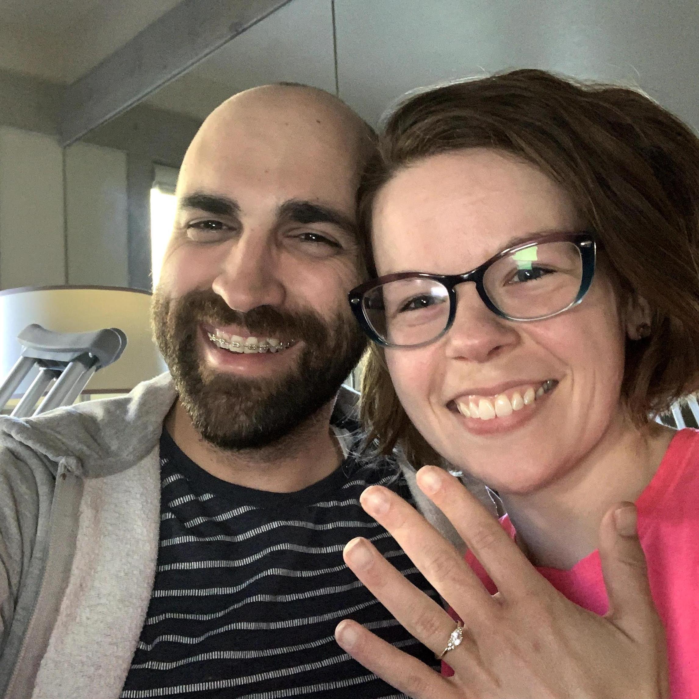 A selfie together after we called our parents to share our engagement news. Note crutches in background. September 2020.