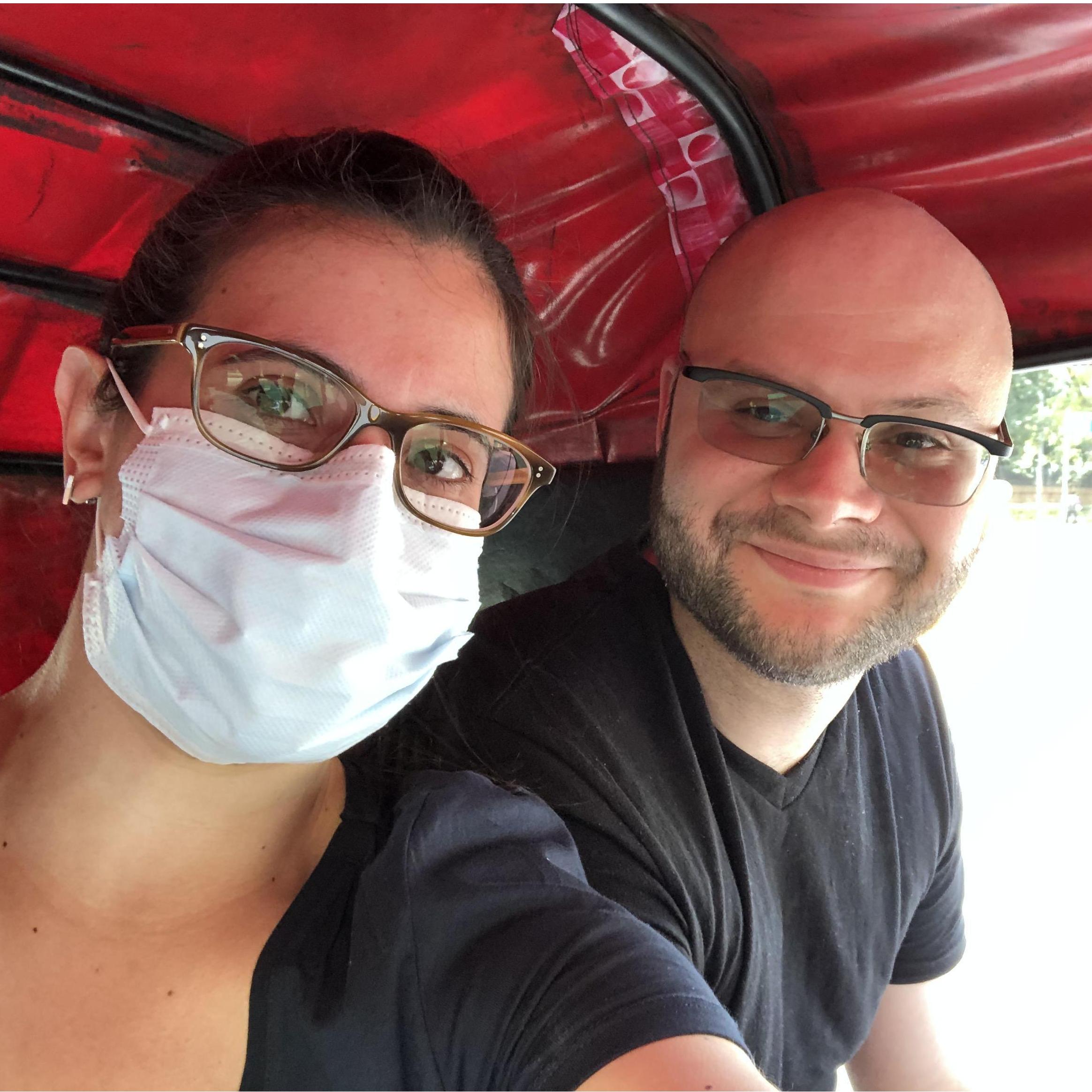 Before COVID, Emily wore a mask in Delhi due to the pollution. This is us in a tuk-tuk (rickshaw) driving around Delhi.