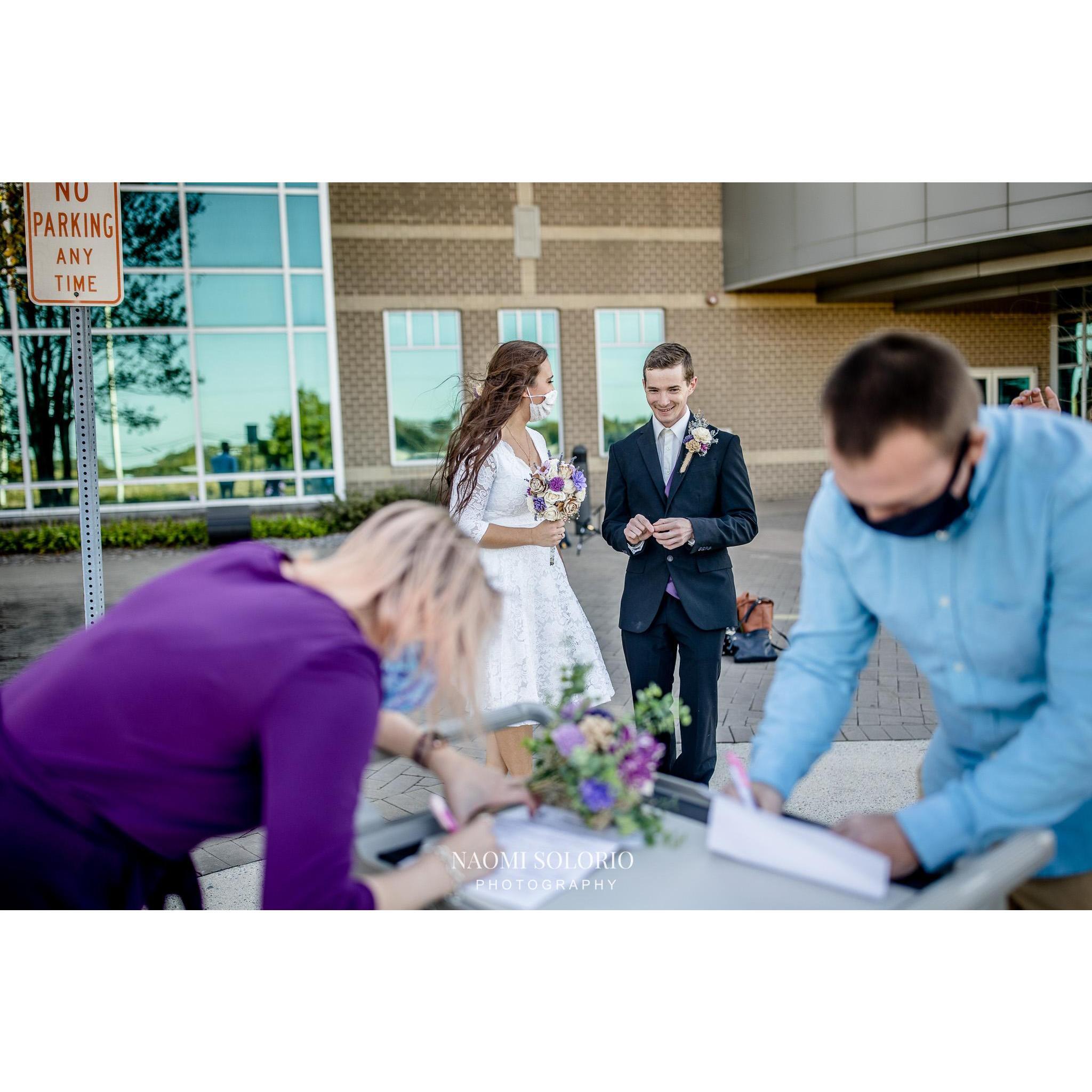 Witnesses signing our marriage license!