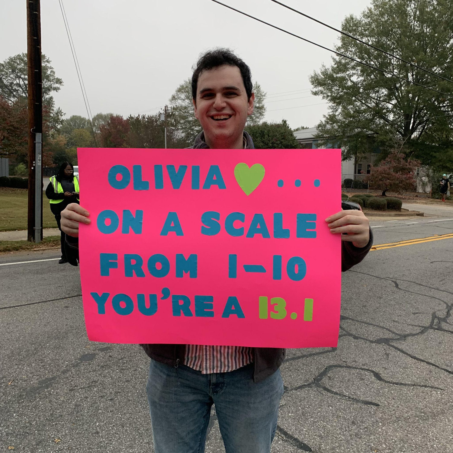 Nate cheering on Olivia during her half marathon
