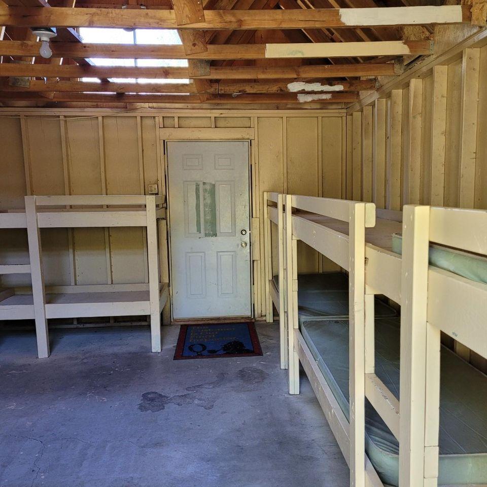 Camp-style bunk beds for guests spending the night at the camp.