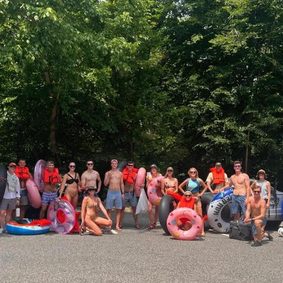 The tubing trip referenced in 'Our Story.' Dave - third from the left. Michelle - sixth from the right.