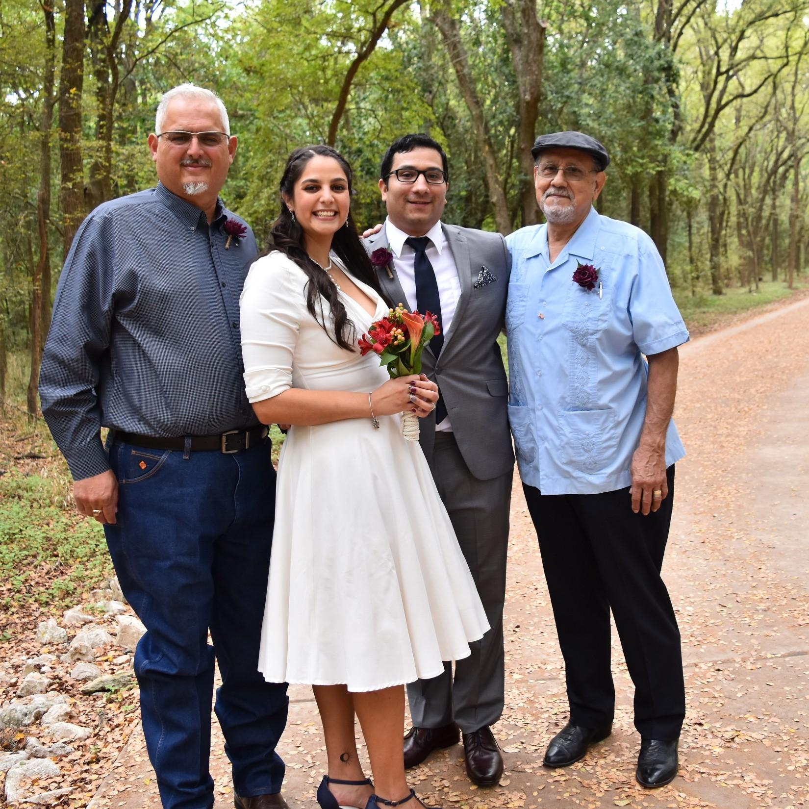 Our official wedding photo with our Dads