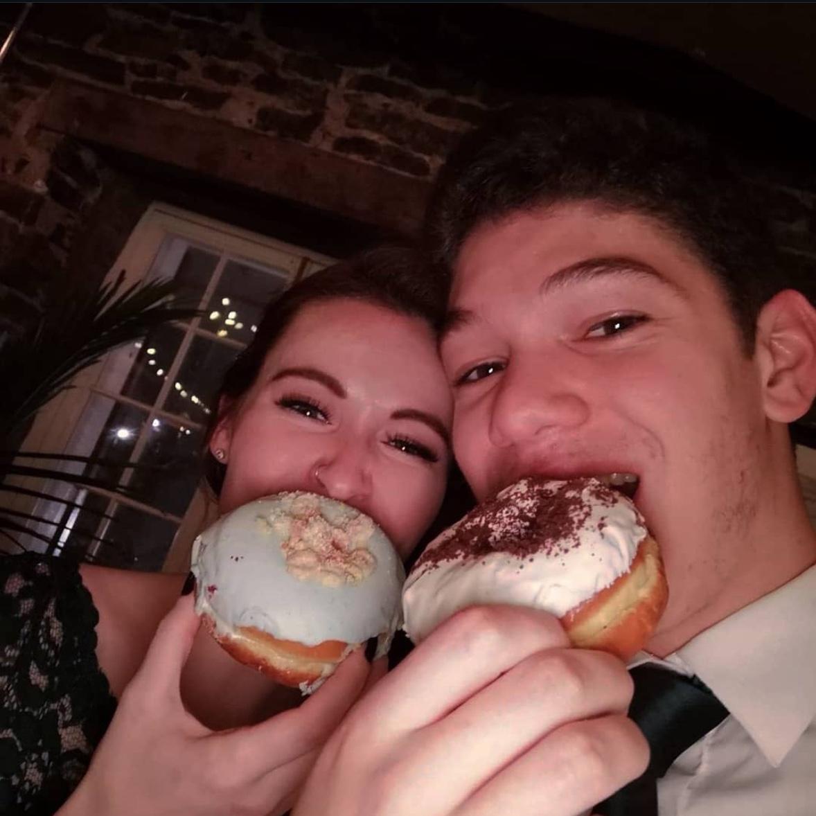 Snacking on the donut wall at Lissa & Tin’s wedding