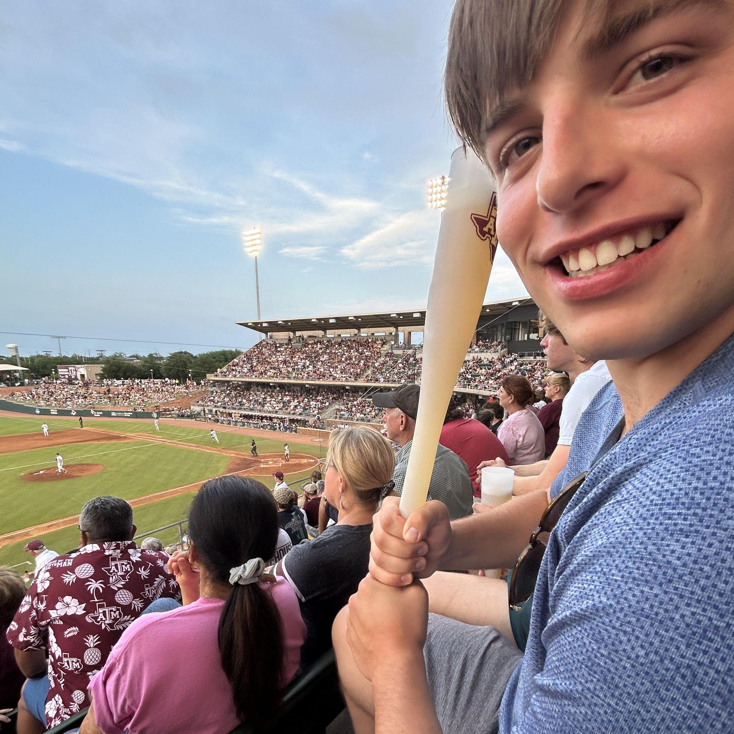 Aggie baseball days. Ben brings kylee and she studies while he enjoys the game. Good times.