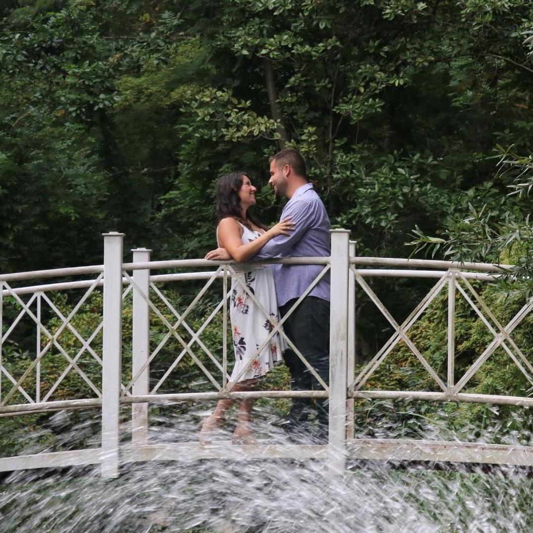 Engagement photo on the bridge at Sayen Gardens!