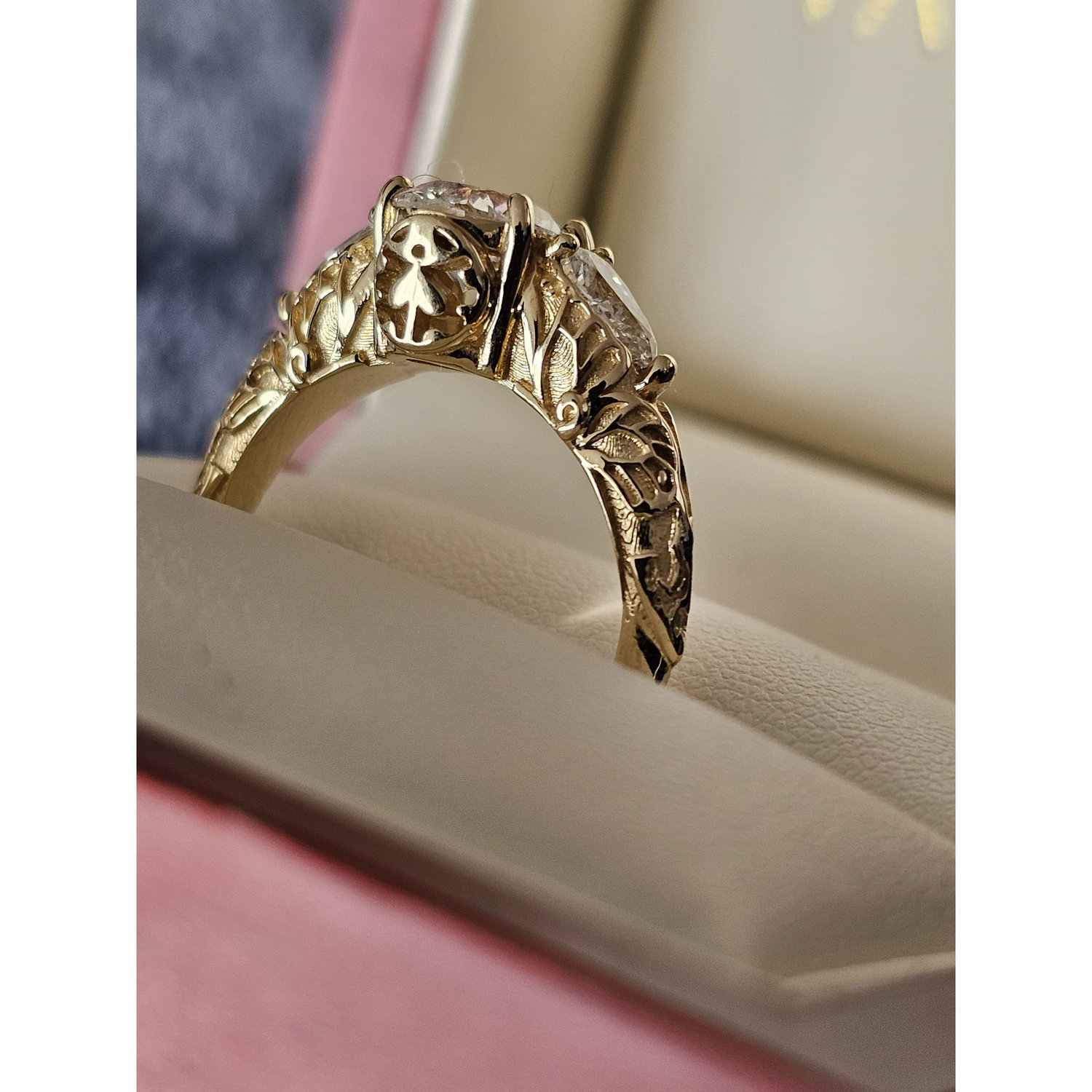 The ring, which Jake had designed with lots of Anna's favorite things. Look closely and you'll find butterfly wings, a ladybug, arrows, and the tip of a princess's crown.