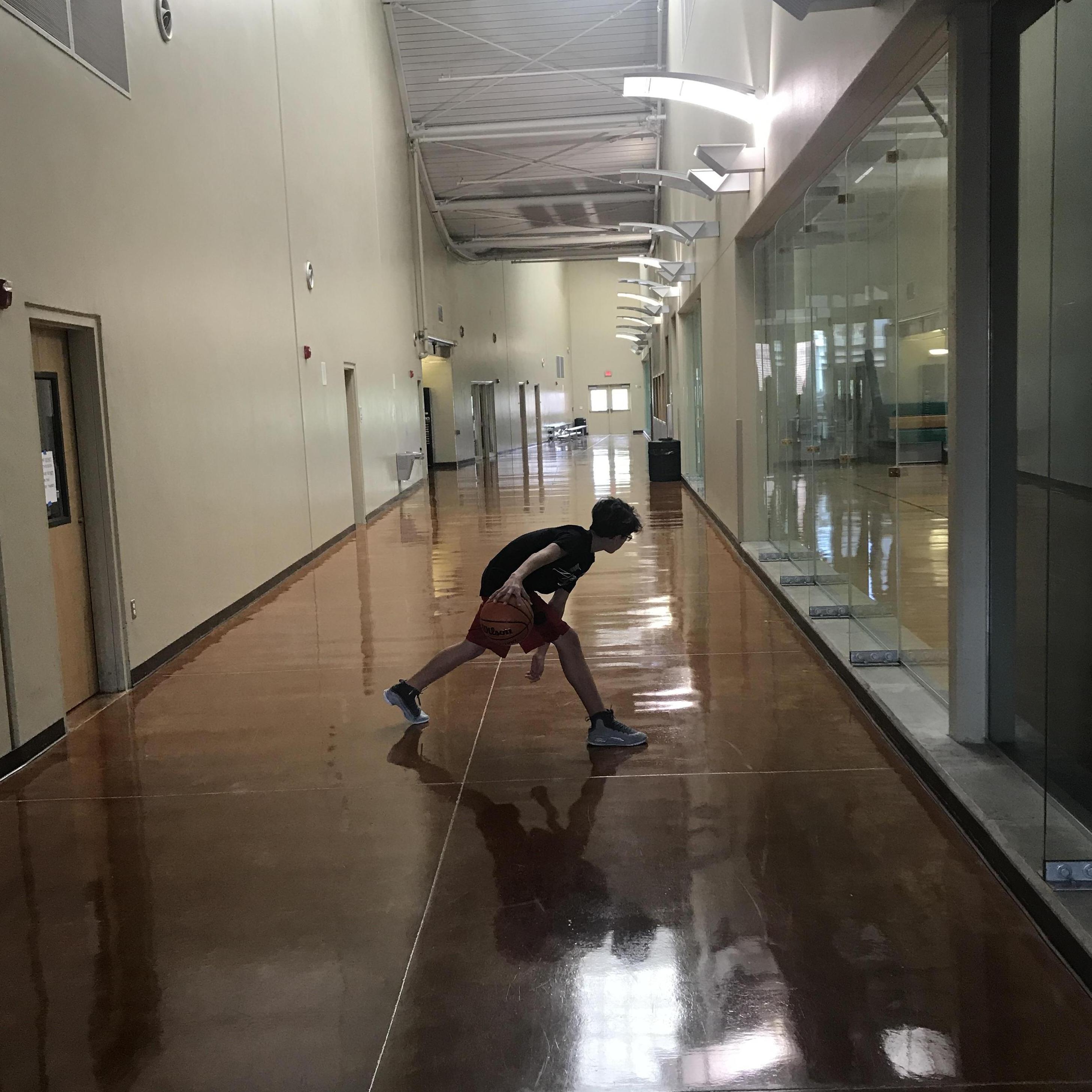 Lukas gives Kevin a run for his money on the court.