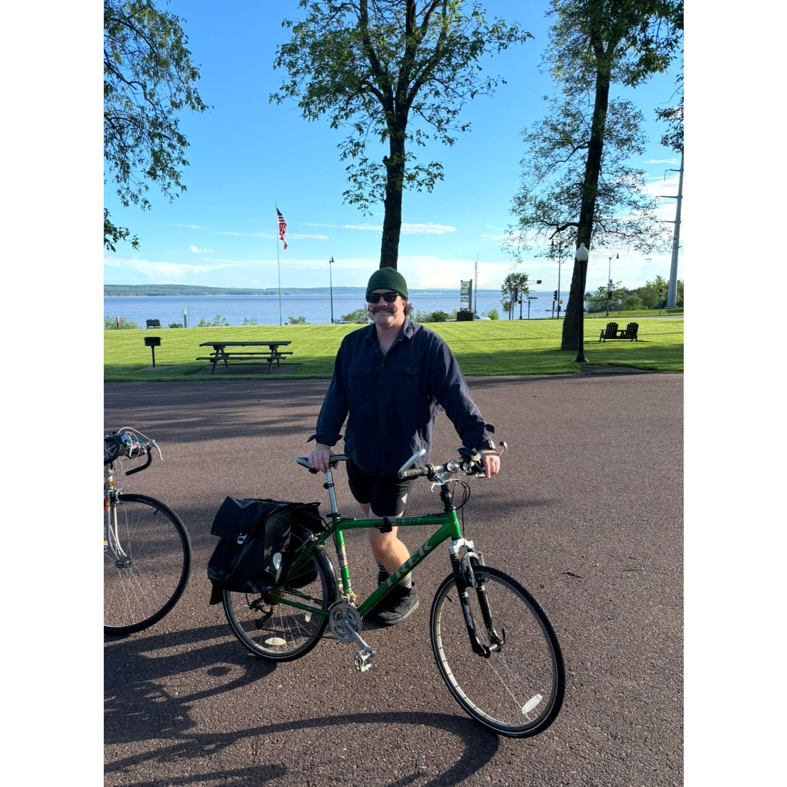Our first bike ride as an engaged couple! The chairs to the right of John are where he proposed the night before at sunset