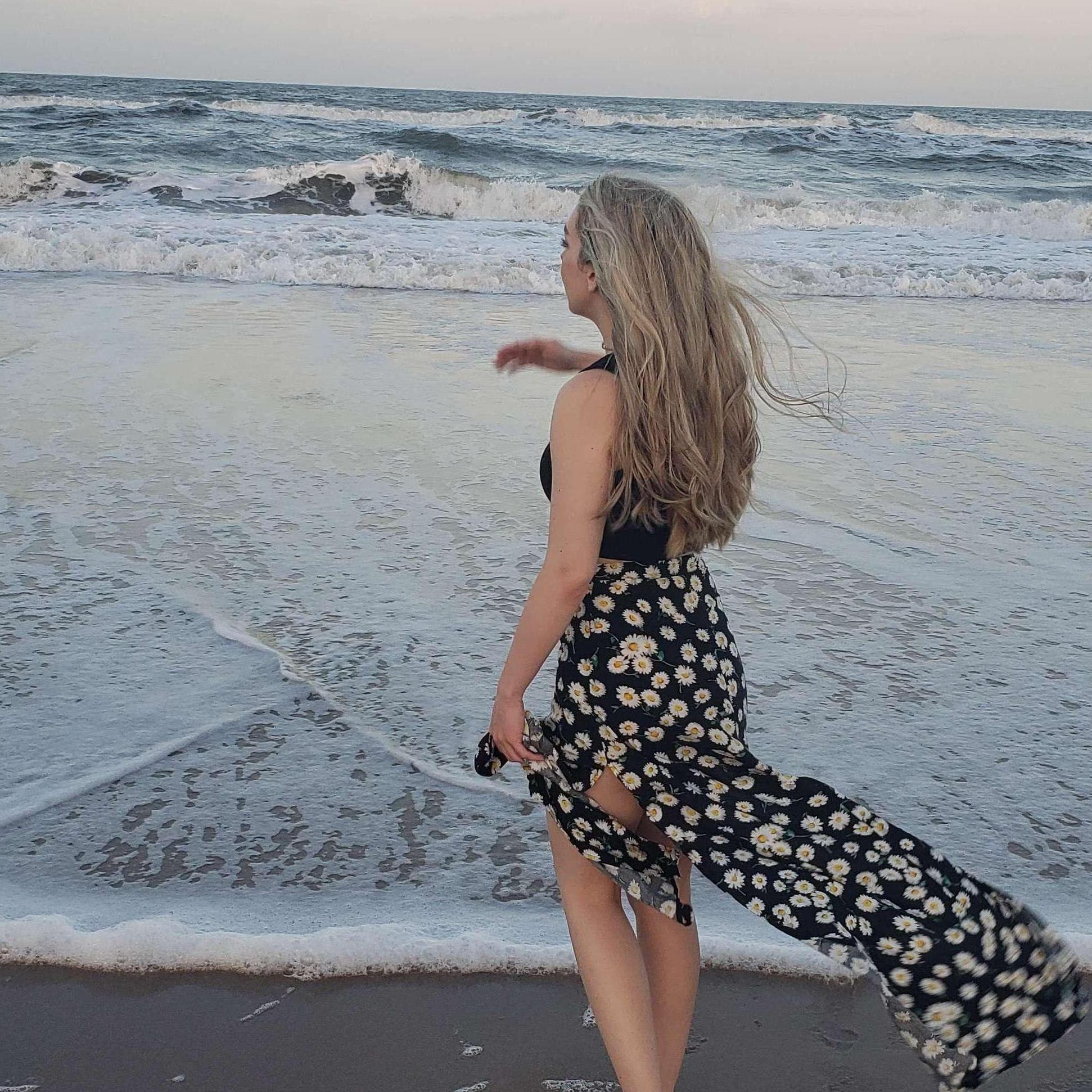 Moments before Jacob Proposed. We were at a beach alone in Florida taking pictures and having a fun day when he told me to turn around and do the classic "Titanic" pose as I turned back around he was down on one knee and the rest is history. '21