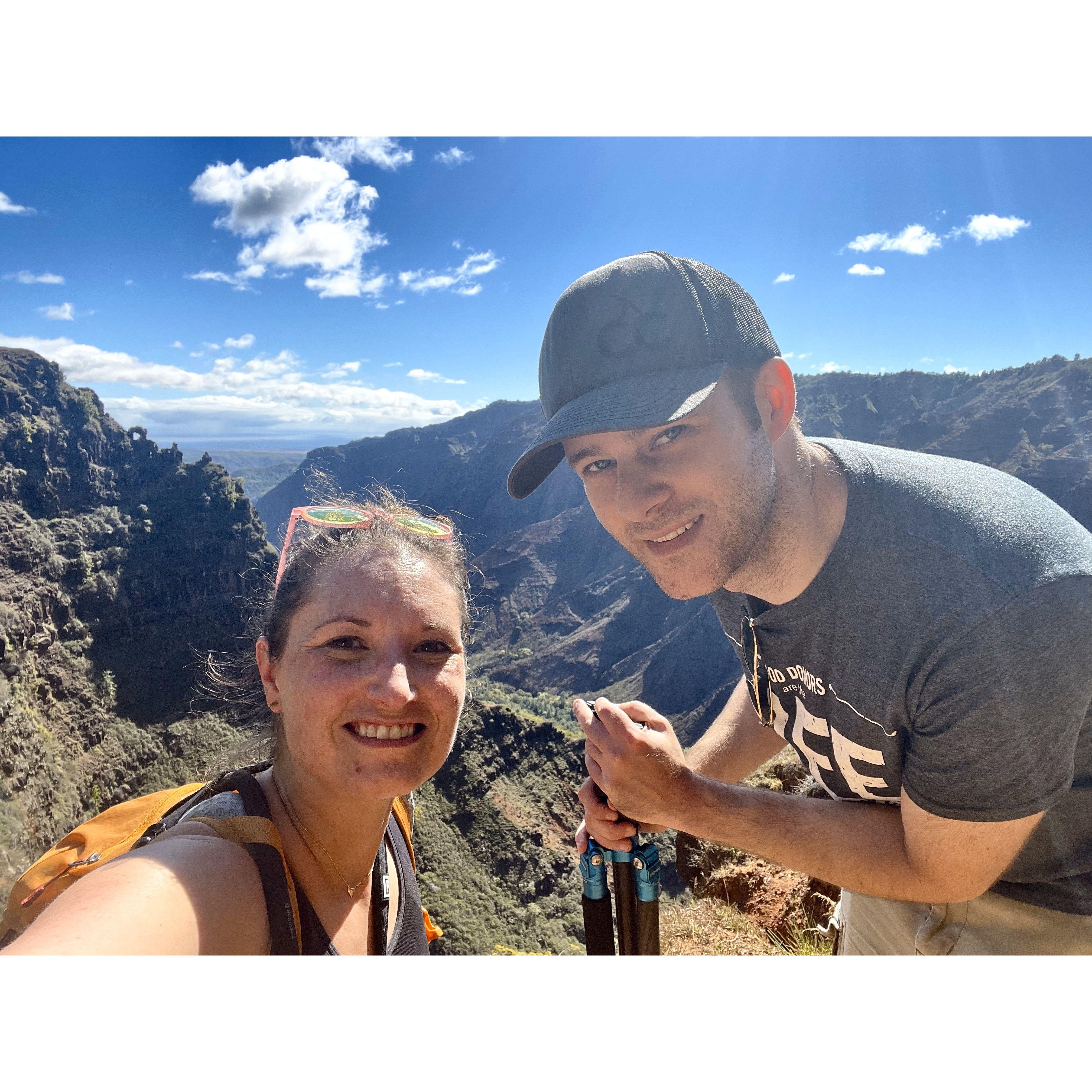 Hike in Waimea Canyon (Grand Canyon of Hawaii) -- hard to see the true scale of the drop off below. November 2021