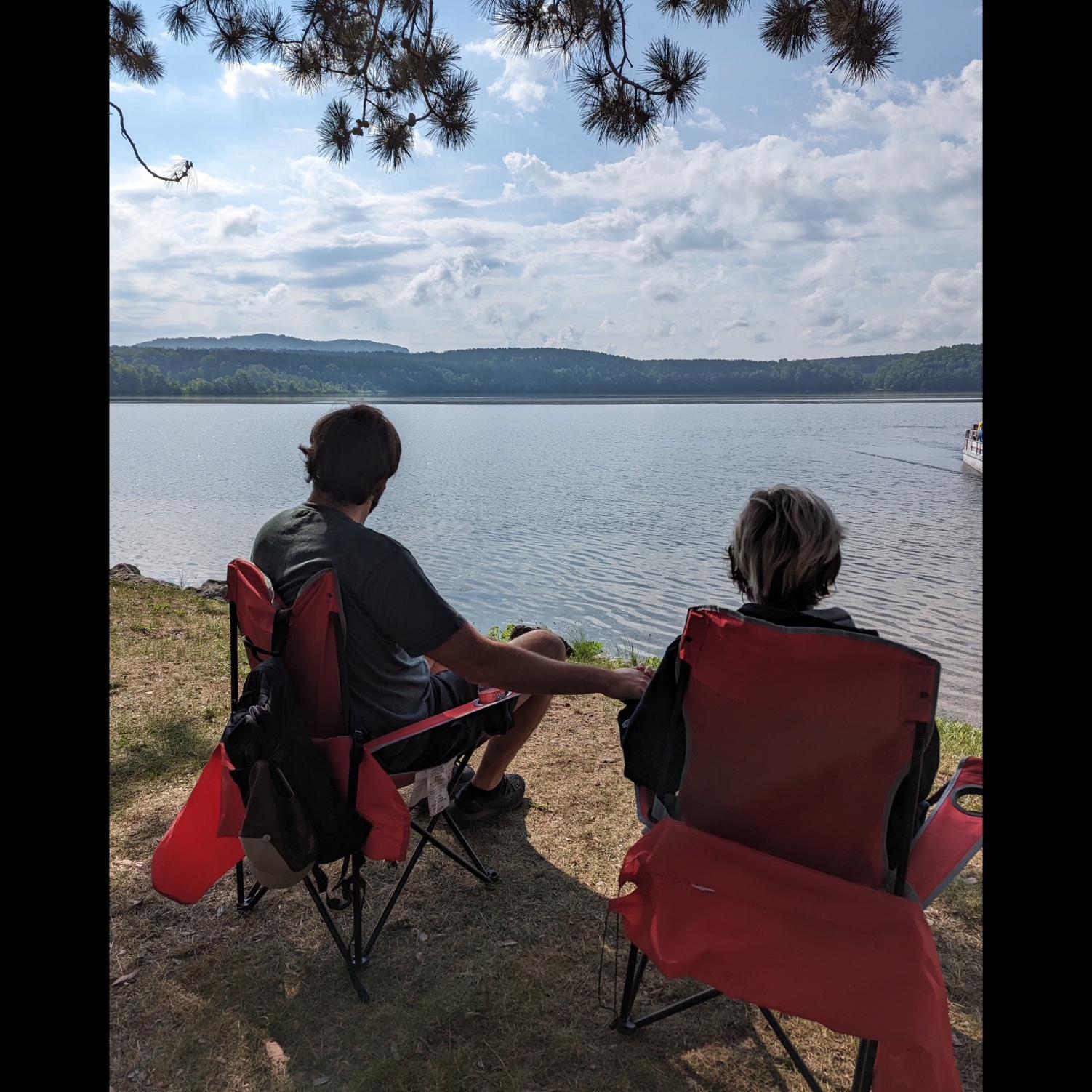 Soaking in the lake at Northern Exposure campground in Mesick, MI one last time before Krista flew back to NC, August 2023