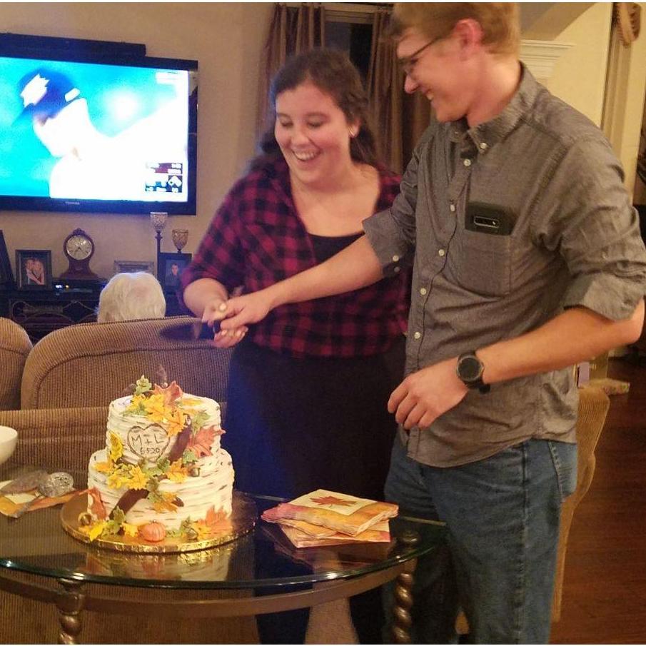 Cutting the cake at our engagement party