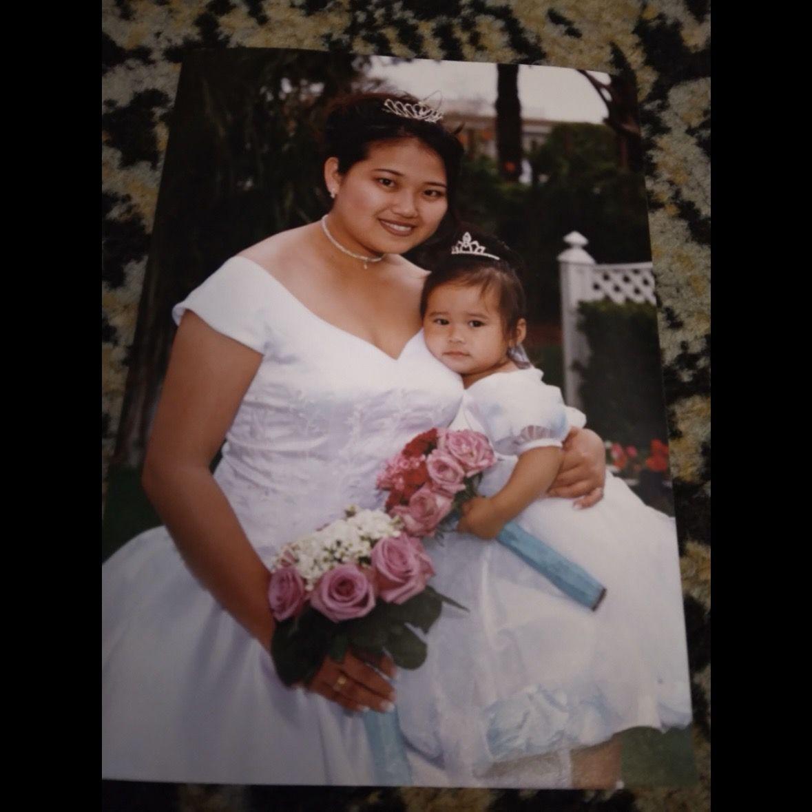 Mini Milla and her mom dressed for her parents’ wedding.