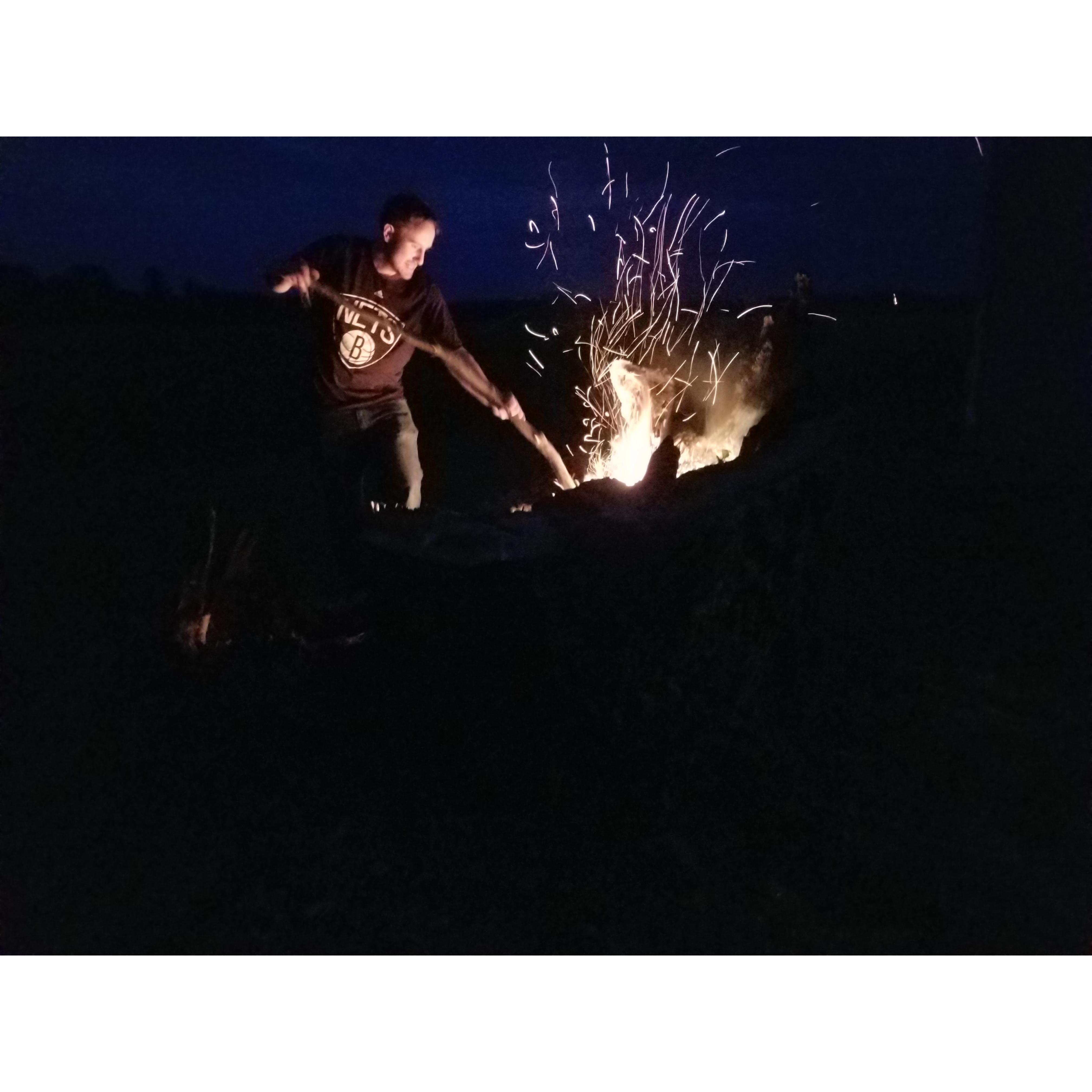 Anthony in his zone - playing with a bonfire:)